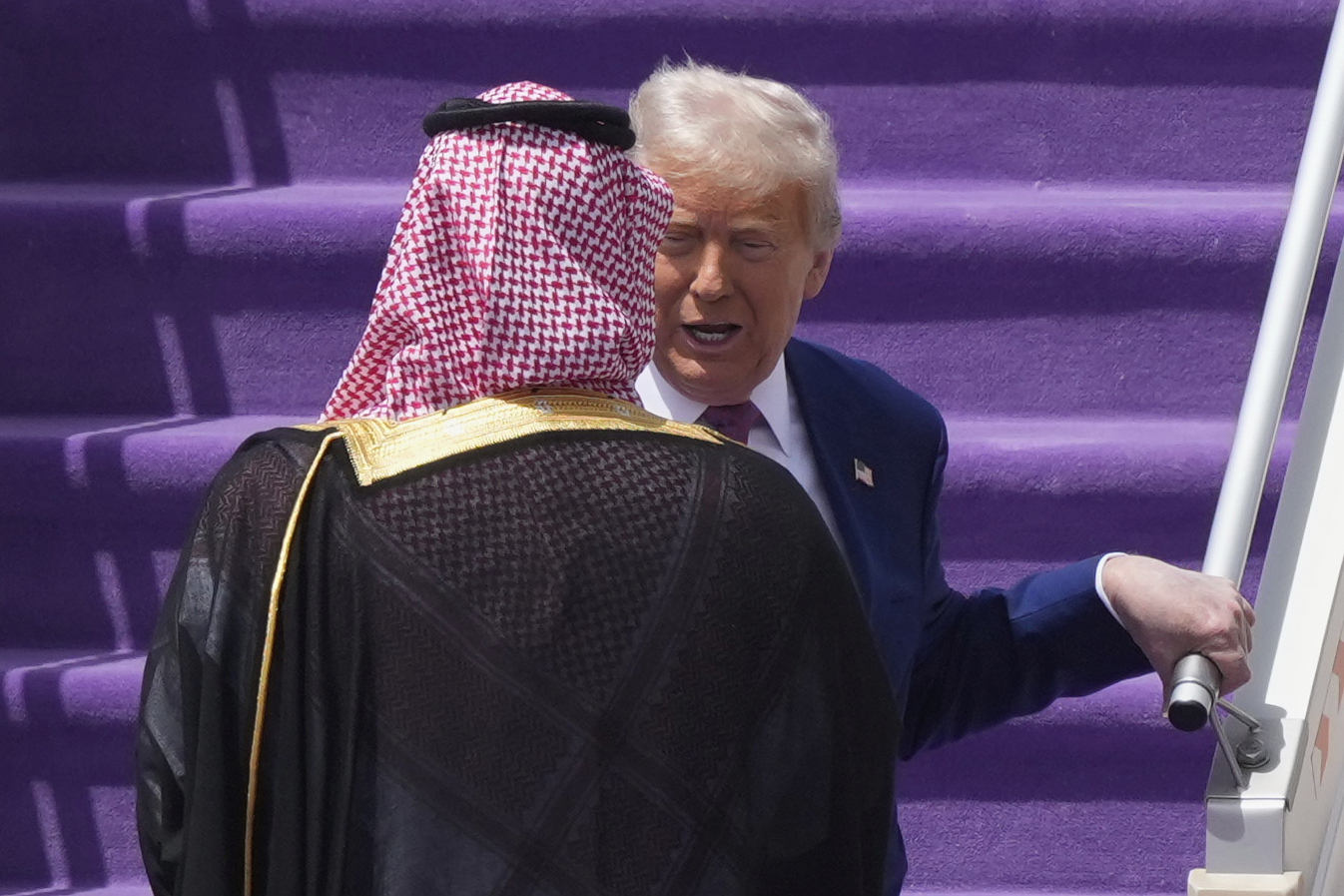 President Donald Trump speaks with Saudi Crown Prince Mohammed bin Salman during an arrival ceremony at the Royal Terminal of King Khalid International Airport in Riyadh, Saudi Arabia, Tuesday, May 13, 2025. (AP Photo/Alex Brandon)