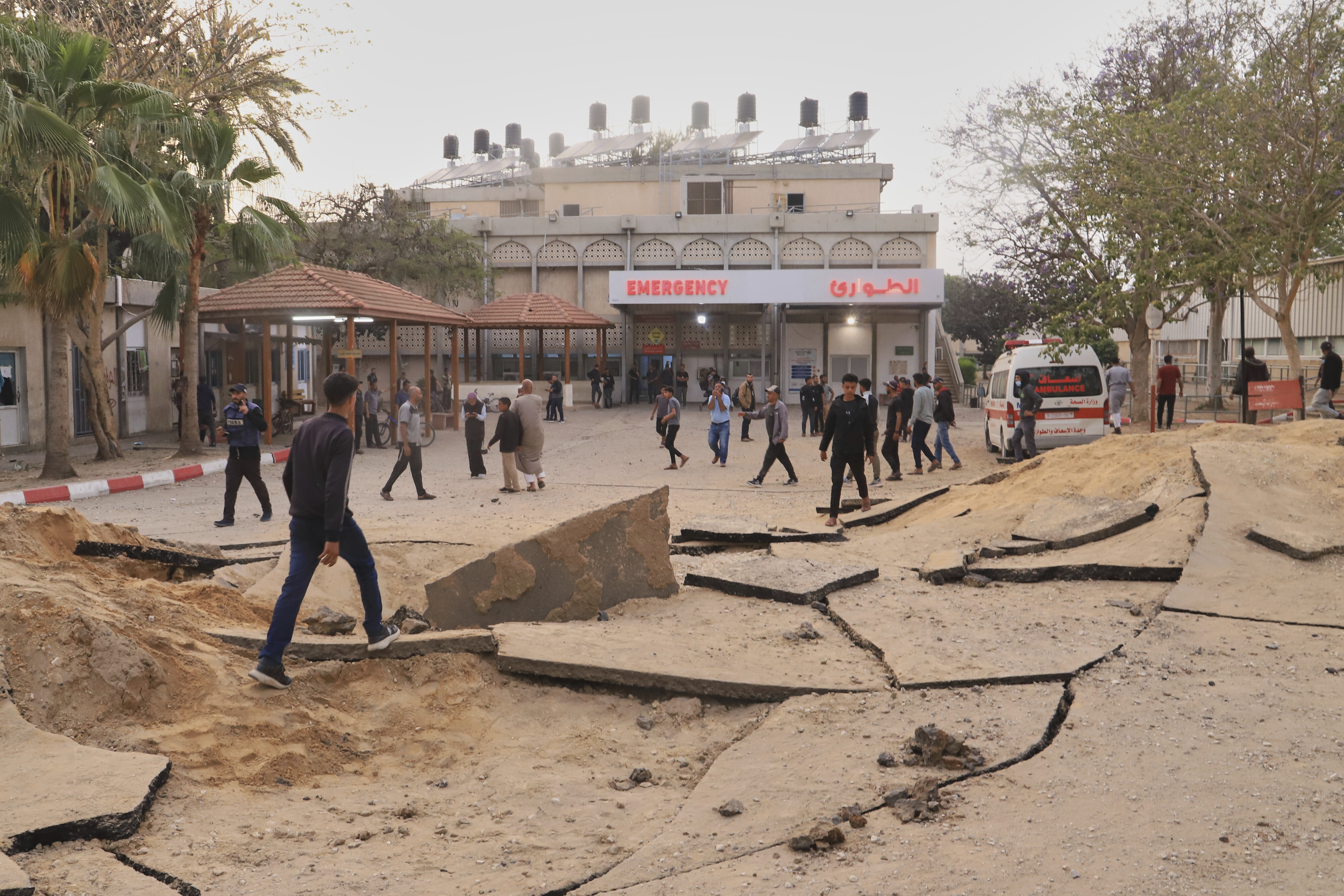 Palestinians inspect the site of an Israeli army airstrike on the European hospital in Khan Younis, Gaza Strip, Tuesday, May 13, 2025. The Israeli military said it had carried out a strike targeting what it said was a Hamas "command and control center" located beneath the hospital. (AP Photo/Mariam Dagga)
