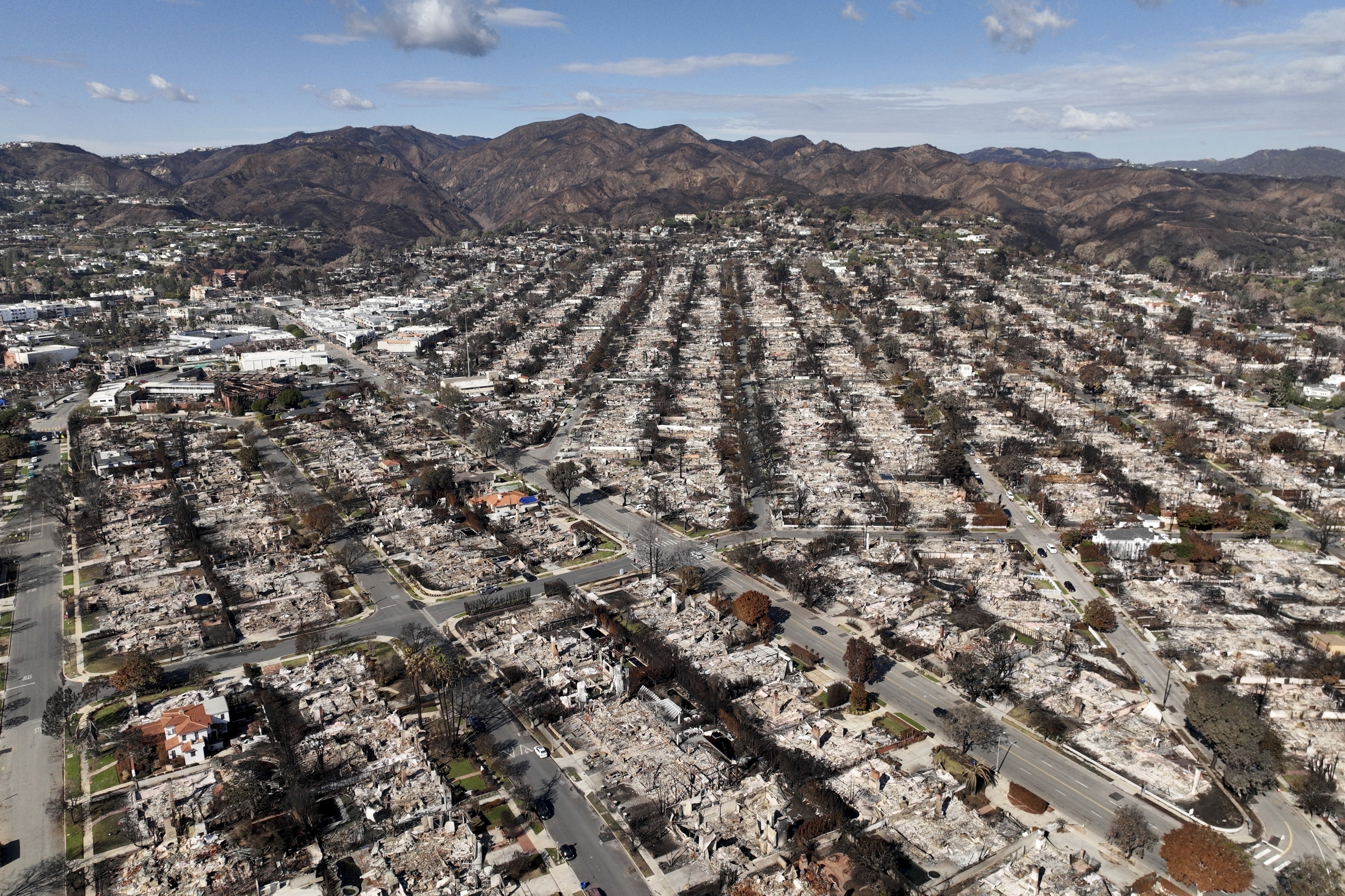 FILE - The devastation from the Palisades Fire is shown in an aerial view in the Pacific Palisades neighborhood of Los Angeles, Monday, Jan. 27, 2025. (AP Photo/Jae C. Hong, File)