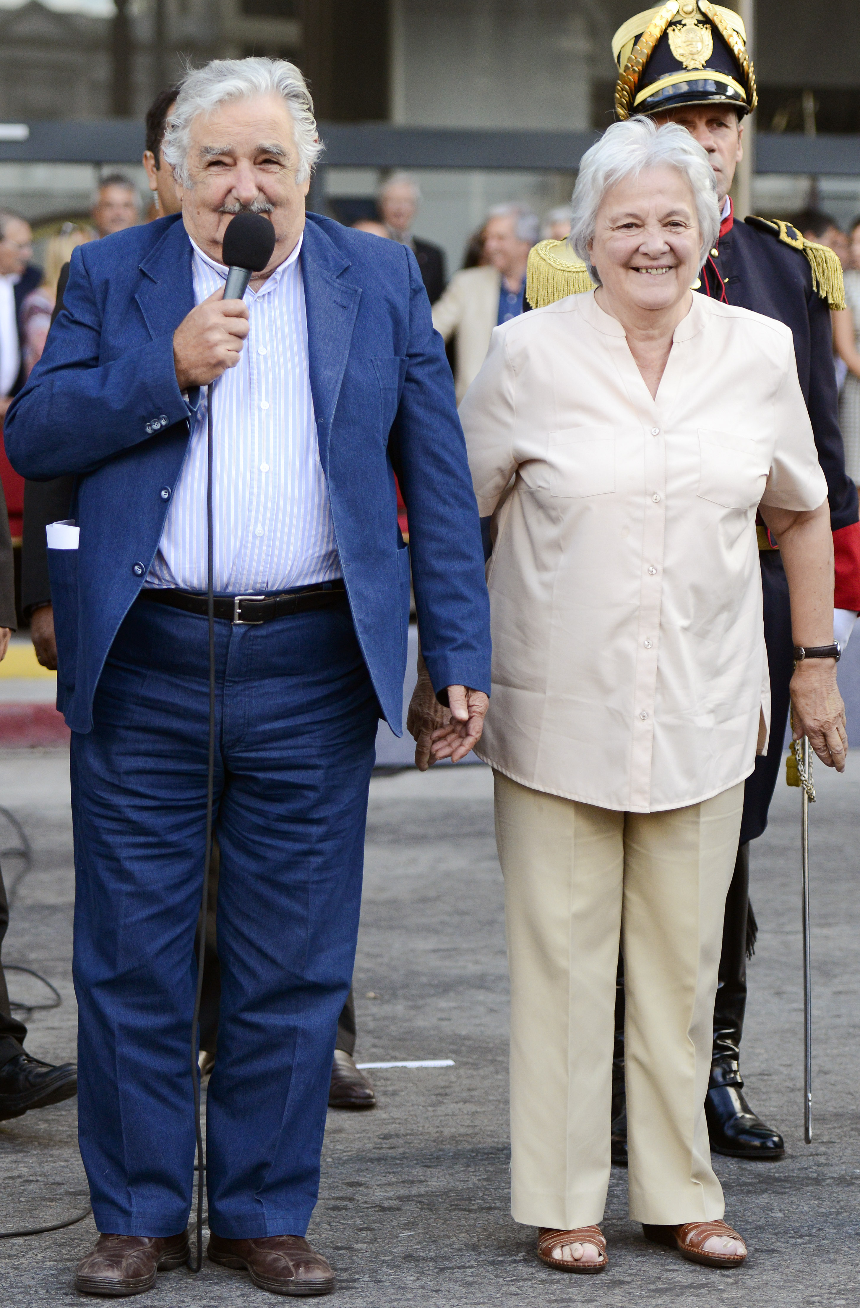 FILE - Uruguay's President Jose Mujica, left, and his wife Lucia Topolansky attend a flag ceremony in Montevideo, Uruguay, Feb. 27, 2015. (AP Photo/Matilde Campodonico, File)