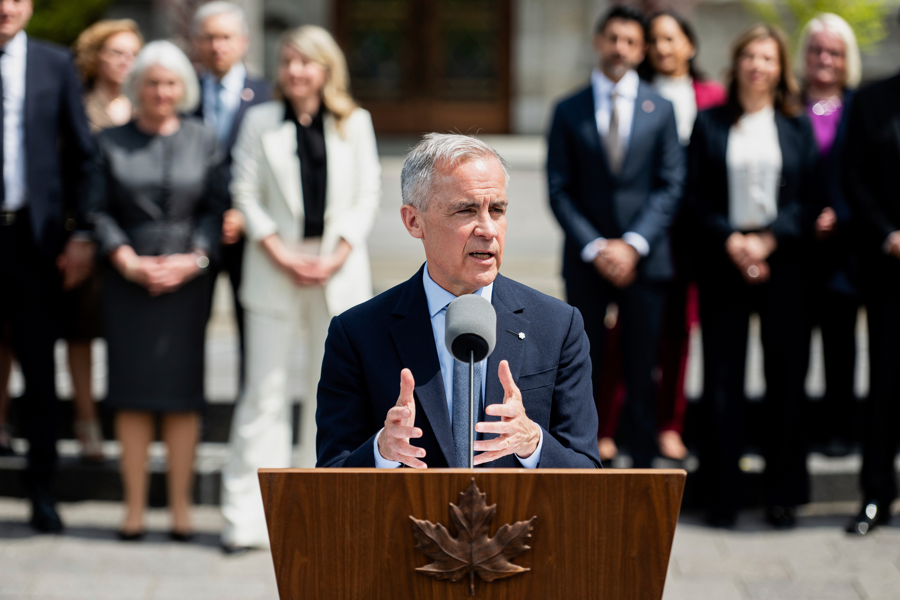 Canada's Prime Minister Mark Carney speaks to reporters following a swearing in ceremony at Rideau Hall in Ottawa, Ontario, Tuesday, May 13, 2025. (Spencer Colby/The Canadian Press via AP)