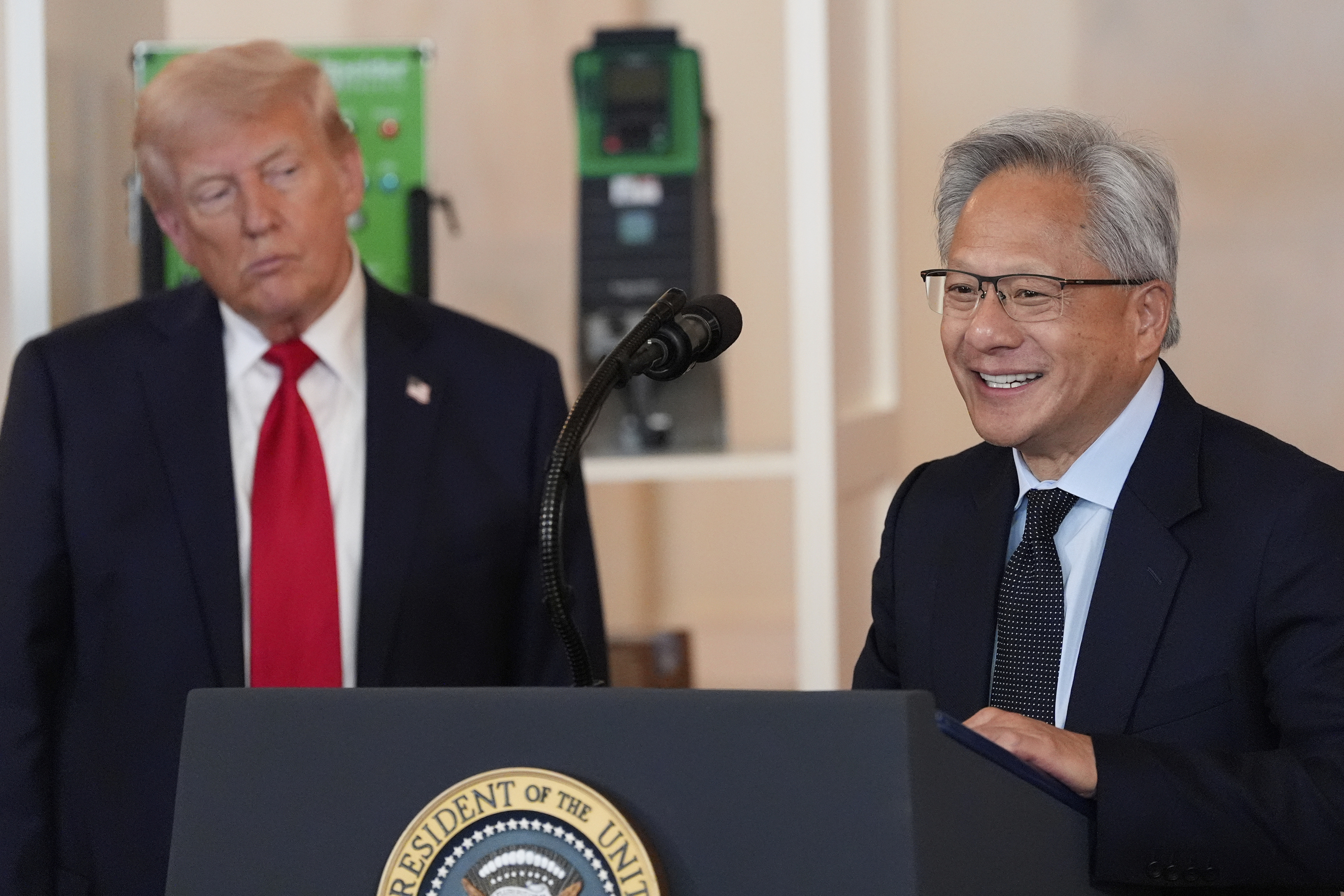 President Donald Trump listens as Nvidia CEO Jensen Huang speaks during an event about investing in America in the Cross Hall of the White House, Wednesday, April 30, 2025, in Washington. (AP Photo/Alex Brandon)