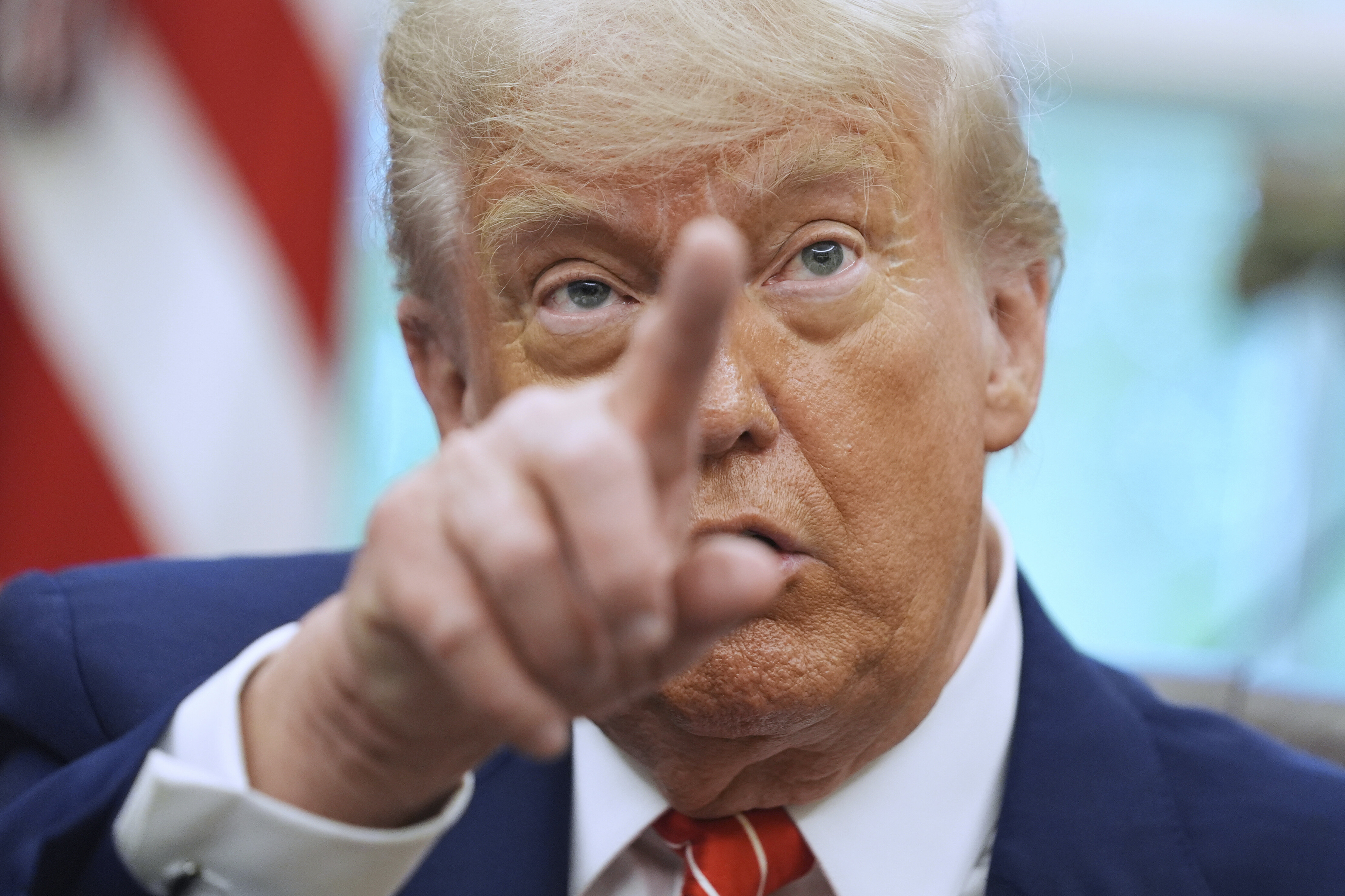 FILE - President Donald Trump gestures as he speaks with reporters in the Oval Office of the White House, May 8, 2025, in Washington. (AP Photo/Evan Vucci, FIle)