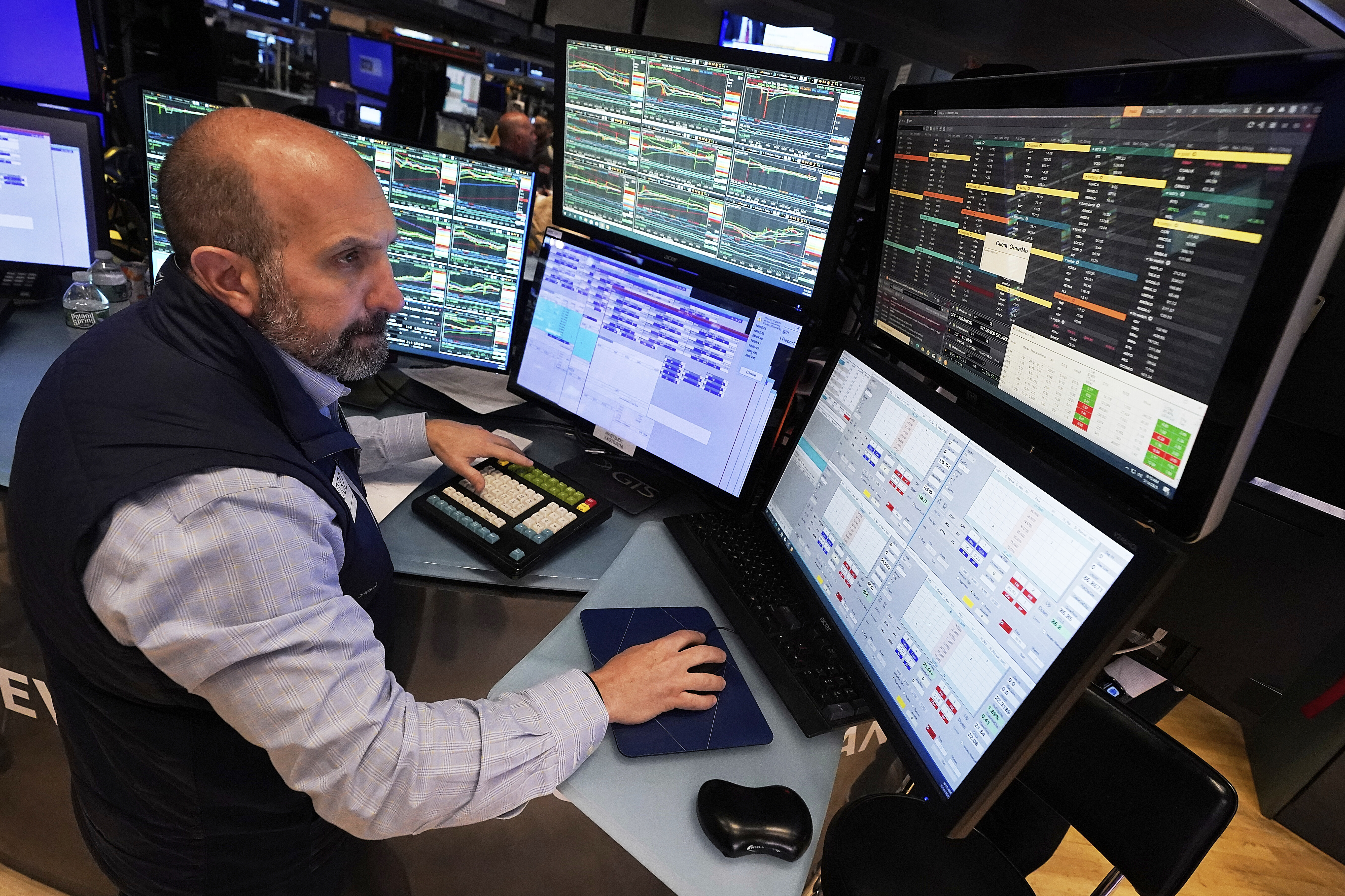 Specialist James Denaro works at his post on the floor of the New York Stock Exchange, Wednesday, May 14, 2025. (AP Photo/Richard Drew)
