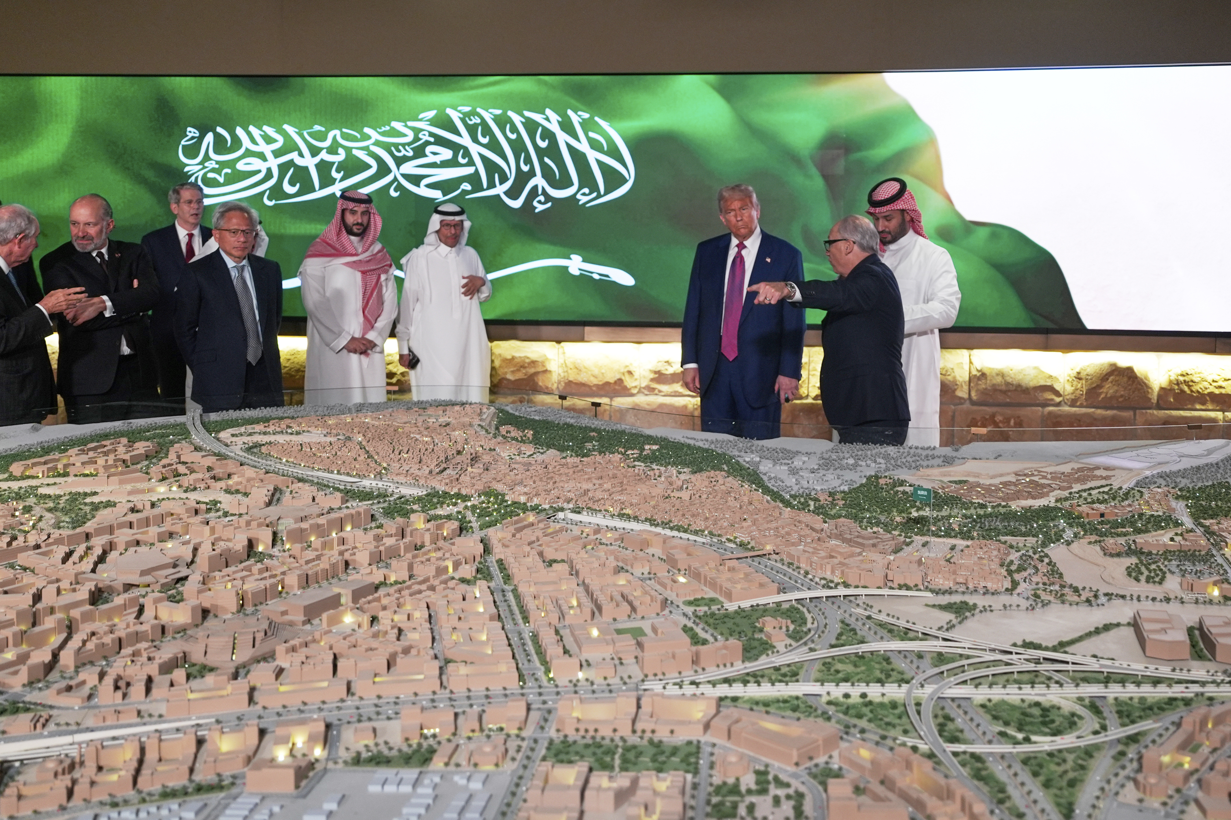 President Donald Trump and His Royal Highness, Mohammed bin Salman al Saud, Crown Prince and Prime Minister, Kingdom of Saudi Arabia, look at a model of a city under construction, Tuesday, May 13, 2025, in Riyadh, Saudi Arabia. (AP Photo/Alex Brandon)