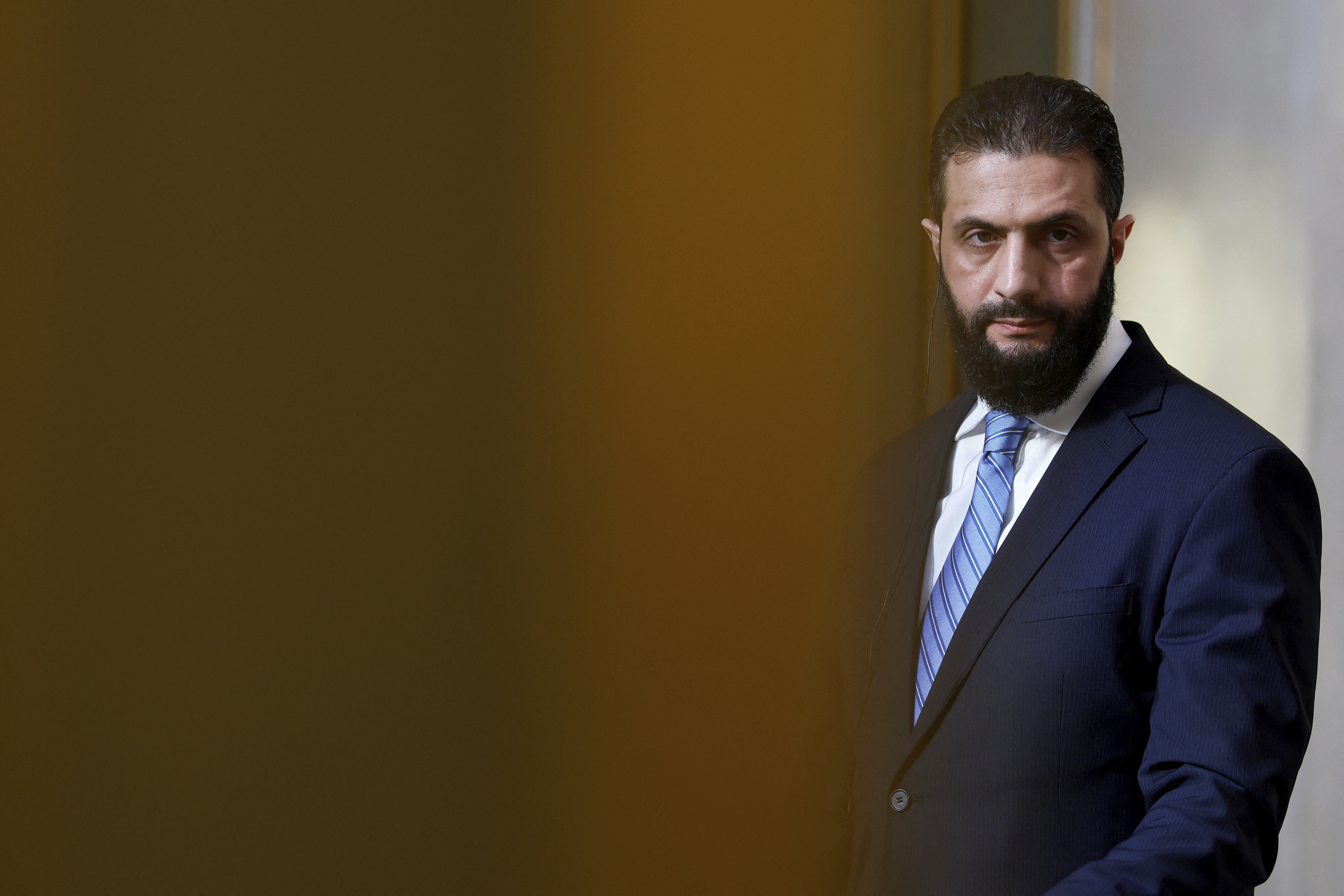 FILE - Syria's interim president, Ahmad al-Sharaa, listens during a joint press conference with French President Emmanuel Macron after a meeting at the Elysee Palace in Paris on May 7, 2025. (Stephanie Lecocq/Pool via AP)