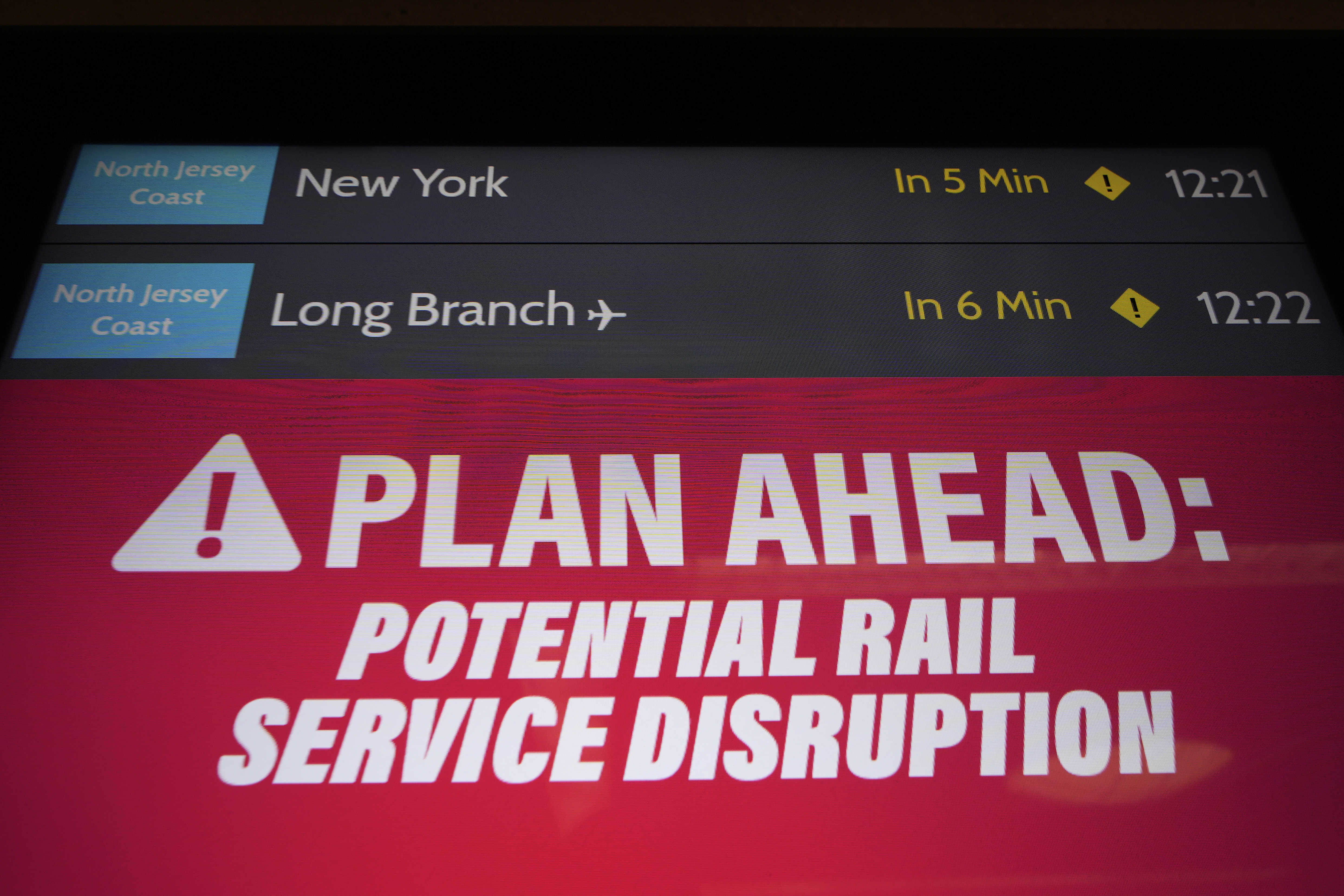 An electronic display advises commuters of potential NJ Transit service disruptions at the Secaucus Junction station in Secaucus, N.J., Wednesday, May 14, 2025. (AP Photo/Seth Wenig)