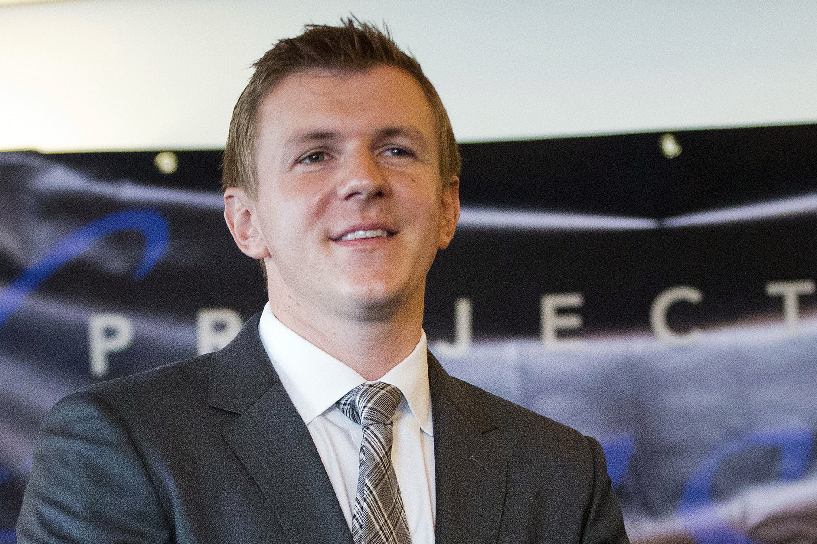 FILE - James O'Keefe, founder of a conservative nonprofit, waits to be introduced during a news conference, Sept. 1, 2015, in Washington. (AP Photo/Pablo Martinez Monsivais, File)