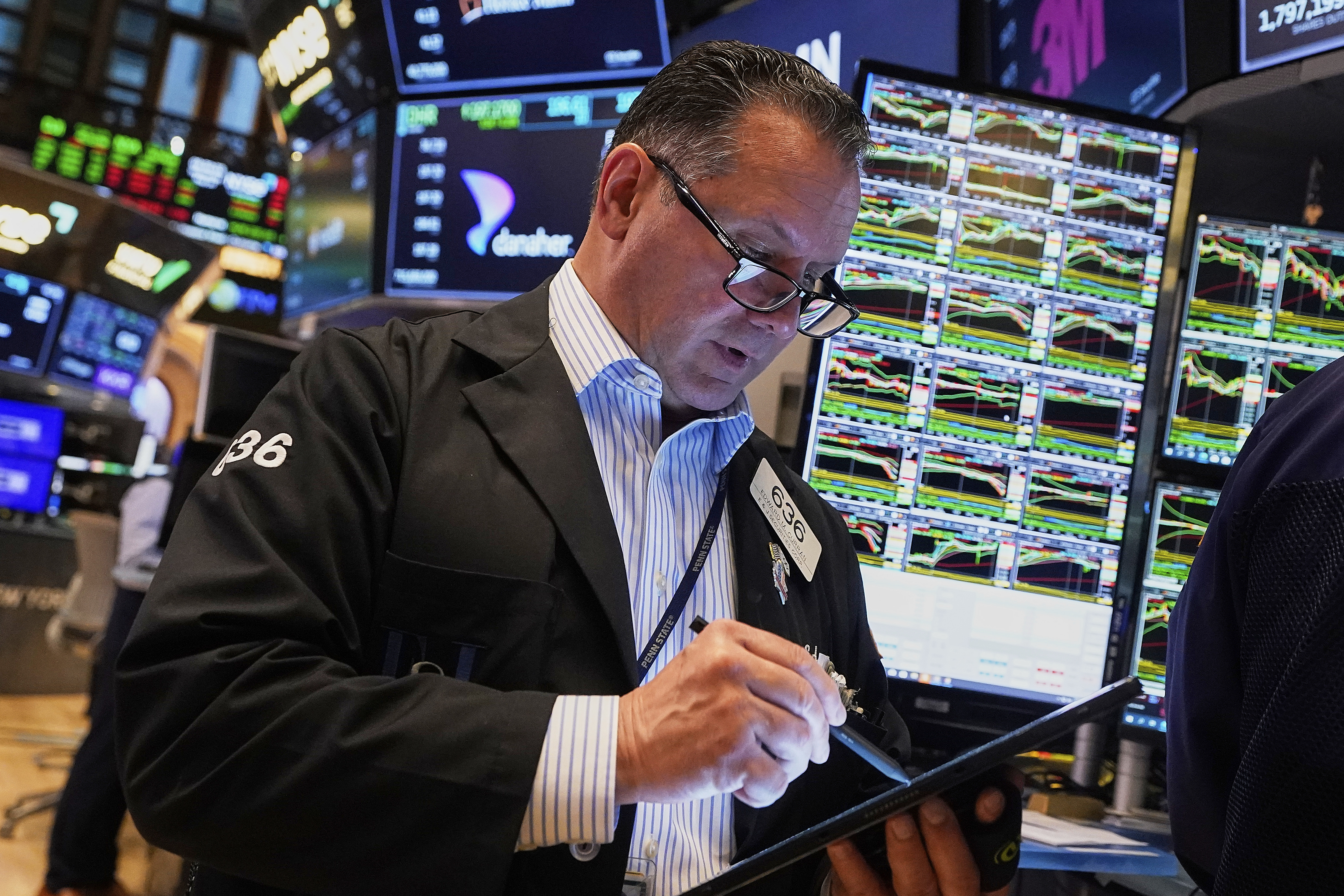 Trader Edward Curran works on the floor of the New York Stock Exchange, Wednesday, May 14, 2025. (AP Photo/Richard Drew)
