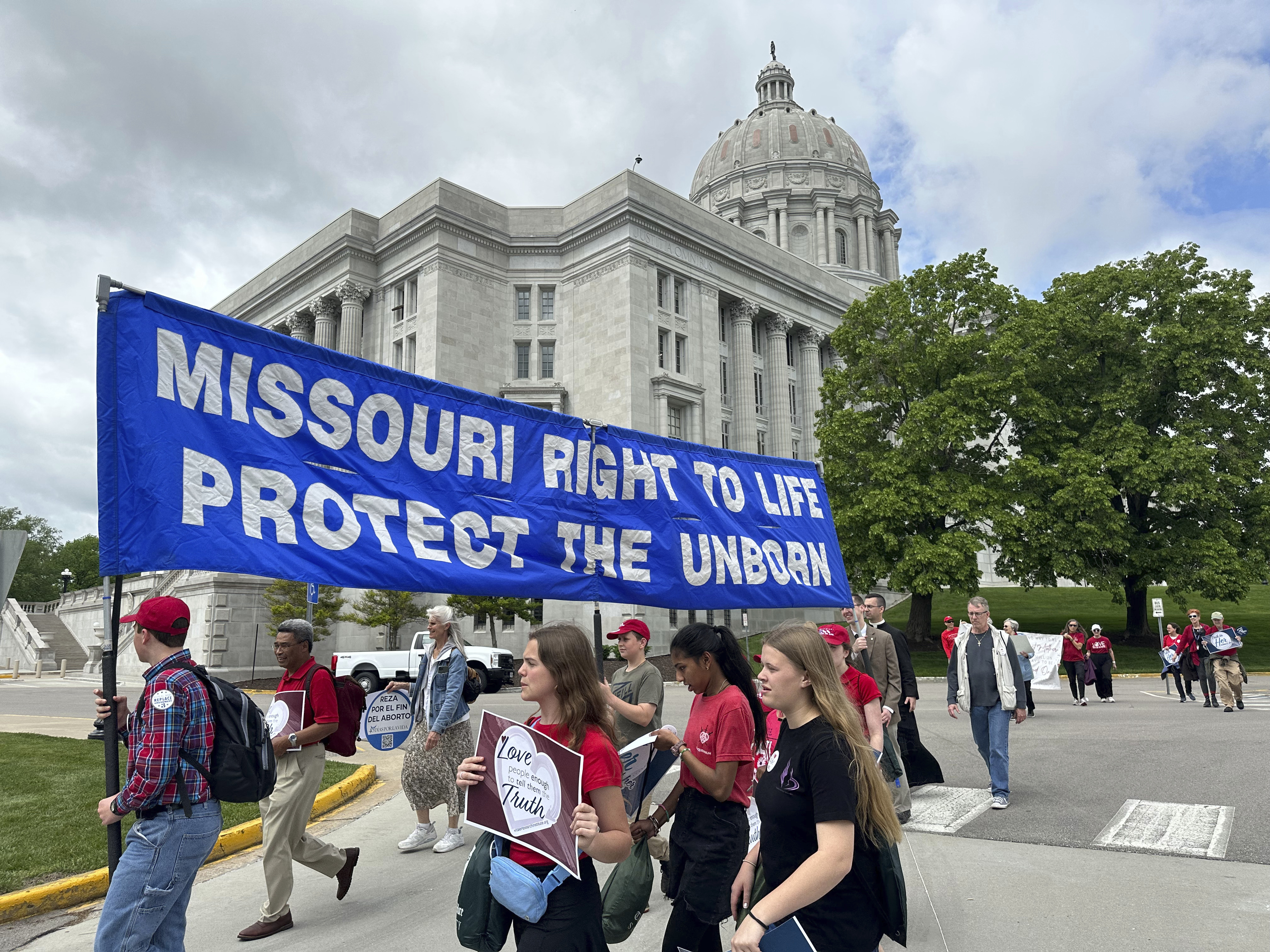 Participants in the Midwest March for Life walk past the Missouri Capitol on May 1, 2025, in Jefferson City, Mo. (AP Photo/David A. Lieb)