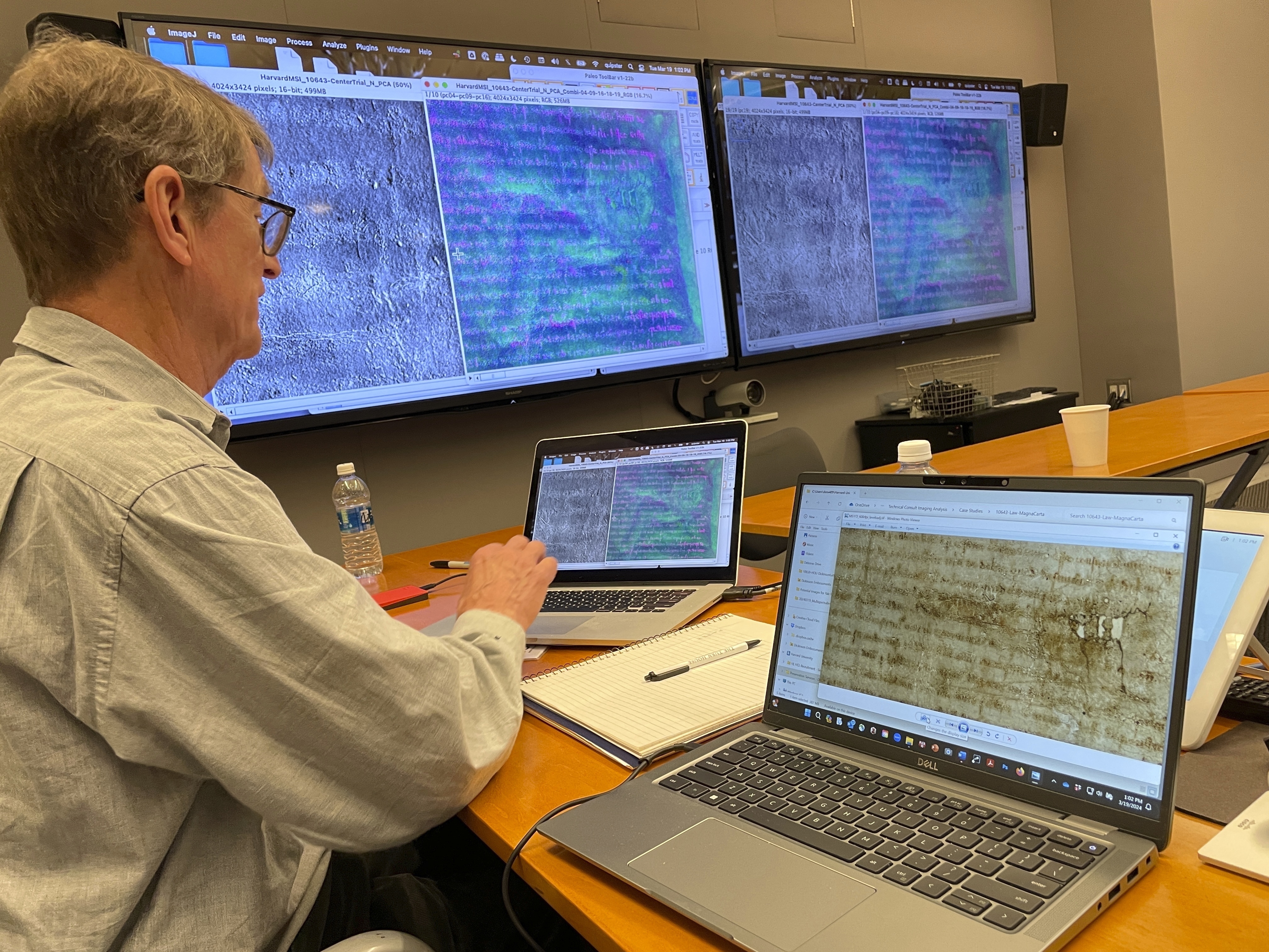 This photo provided by the Harvard Weissman Center shows imaging technology being used to help its librarians see details on a rare, faded copy of the Magna Carta from 1300 on March 19, 2024, in Cambridge, Mass. (Debora Mayer/Harvard Weissman Center via AP)