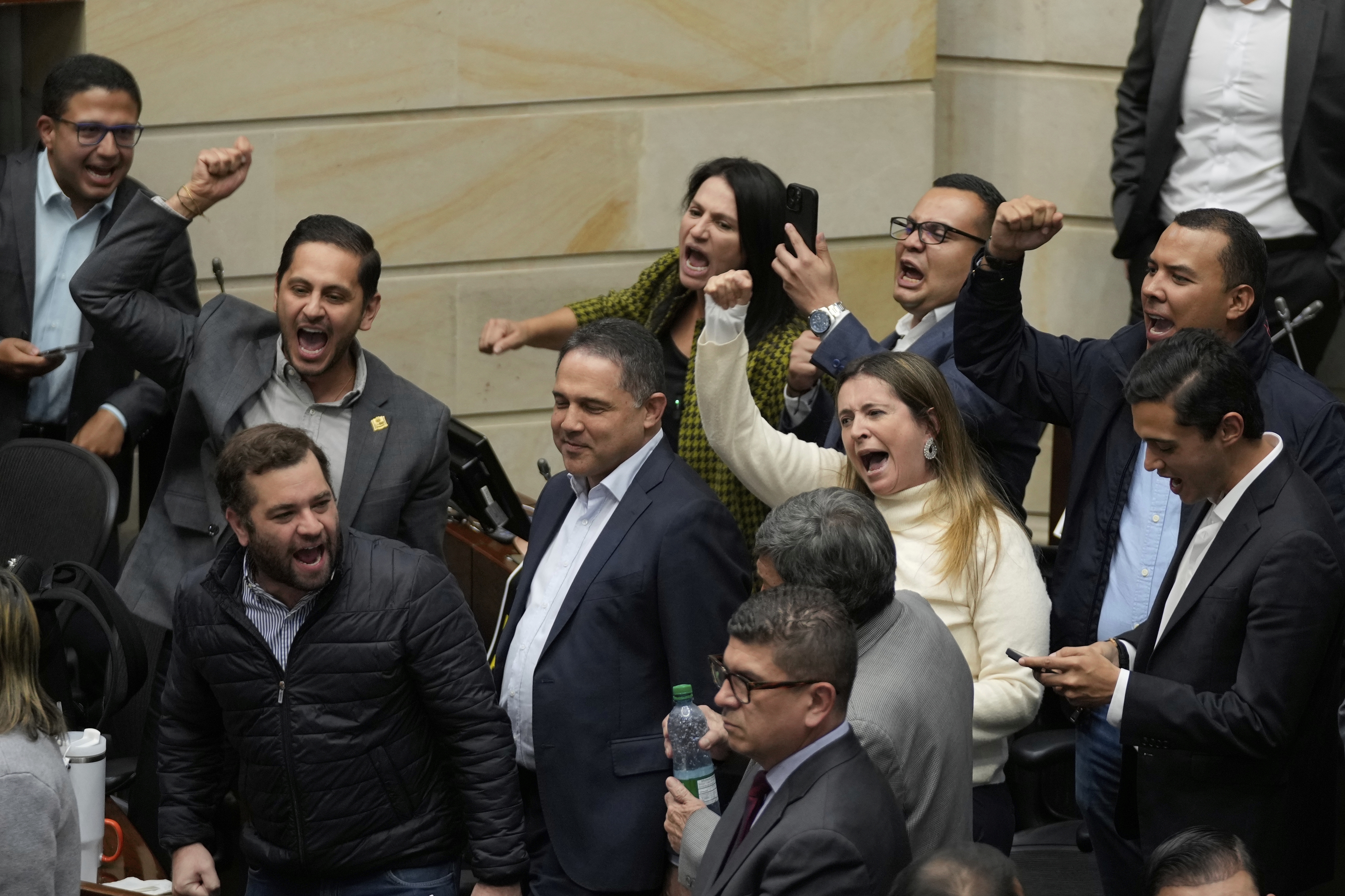Opposition senators celebrate after voting against a labor reform referendum proposed by the government, in Bogota, Colombia, Wednesday, May 14, 2025. (AP Photo/Fernando Vergara)