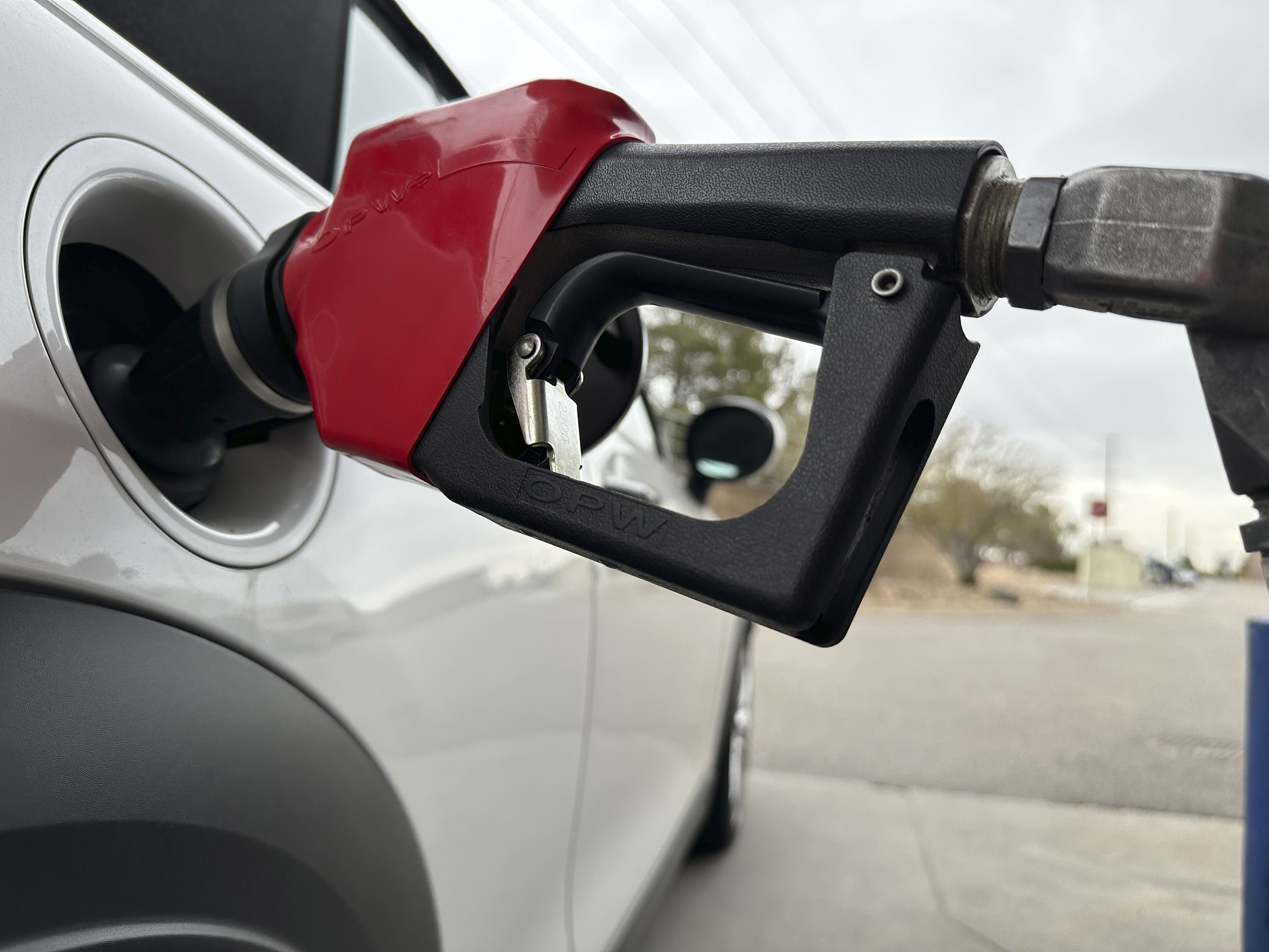 FILE - A motorist fills up the gasoline tank of a vehicle at a Costco warehouse Tuesday, April 1, 2025, in Thornton, Colo. (AP Photo/David Zalubowski, File)