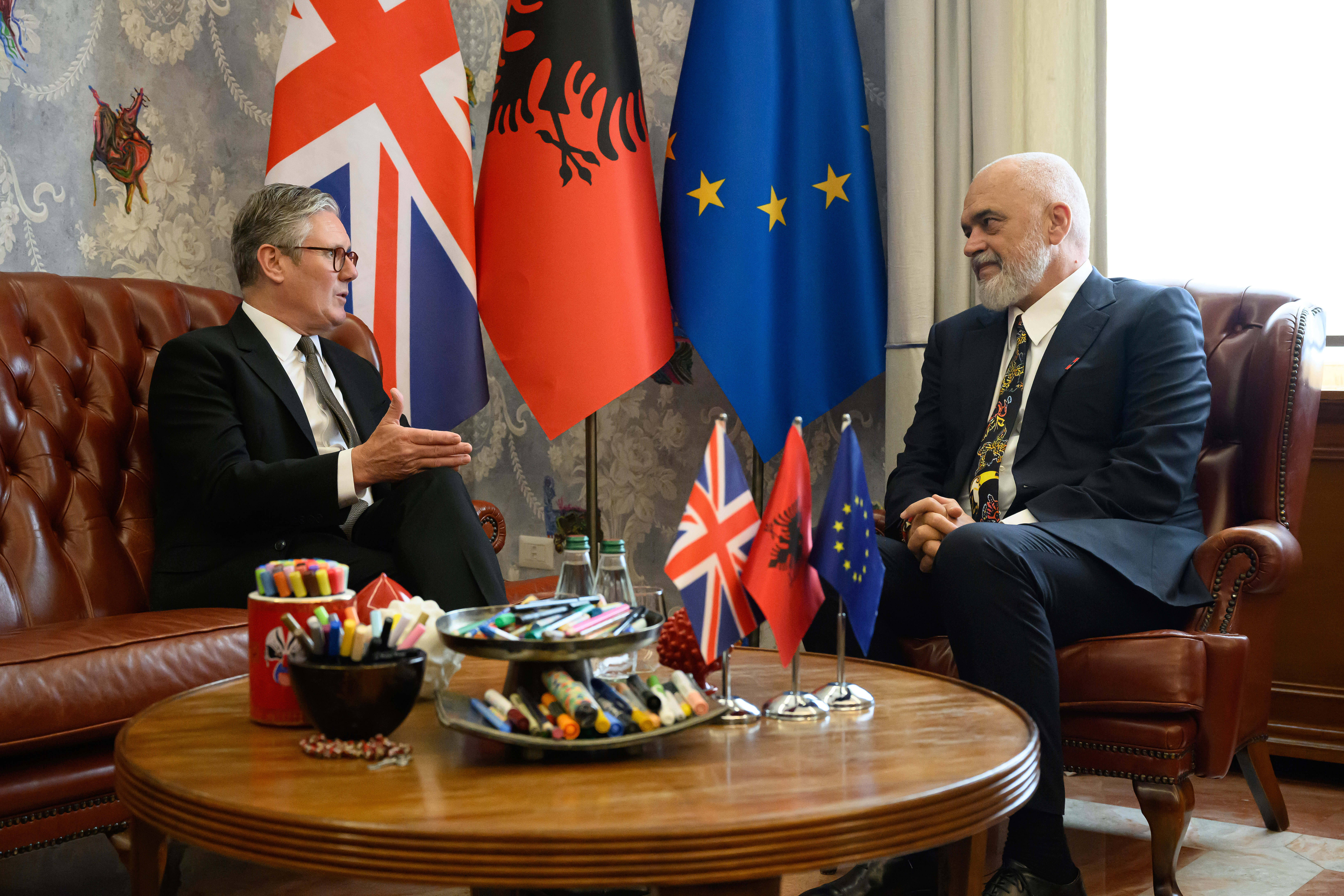 Britain's Prime Minister Keir Starmer, left, is welcomed by Albania's Prime Minister Edi Rama at the Kryeministria in Tirana, Albania, Thursday May 15, 2025. (Leon Neal/Pool via AP)
