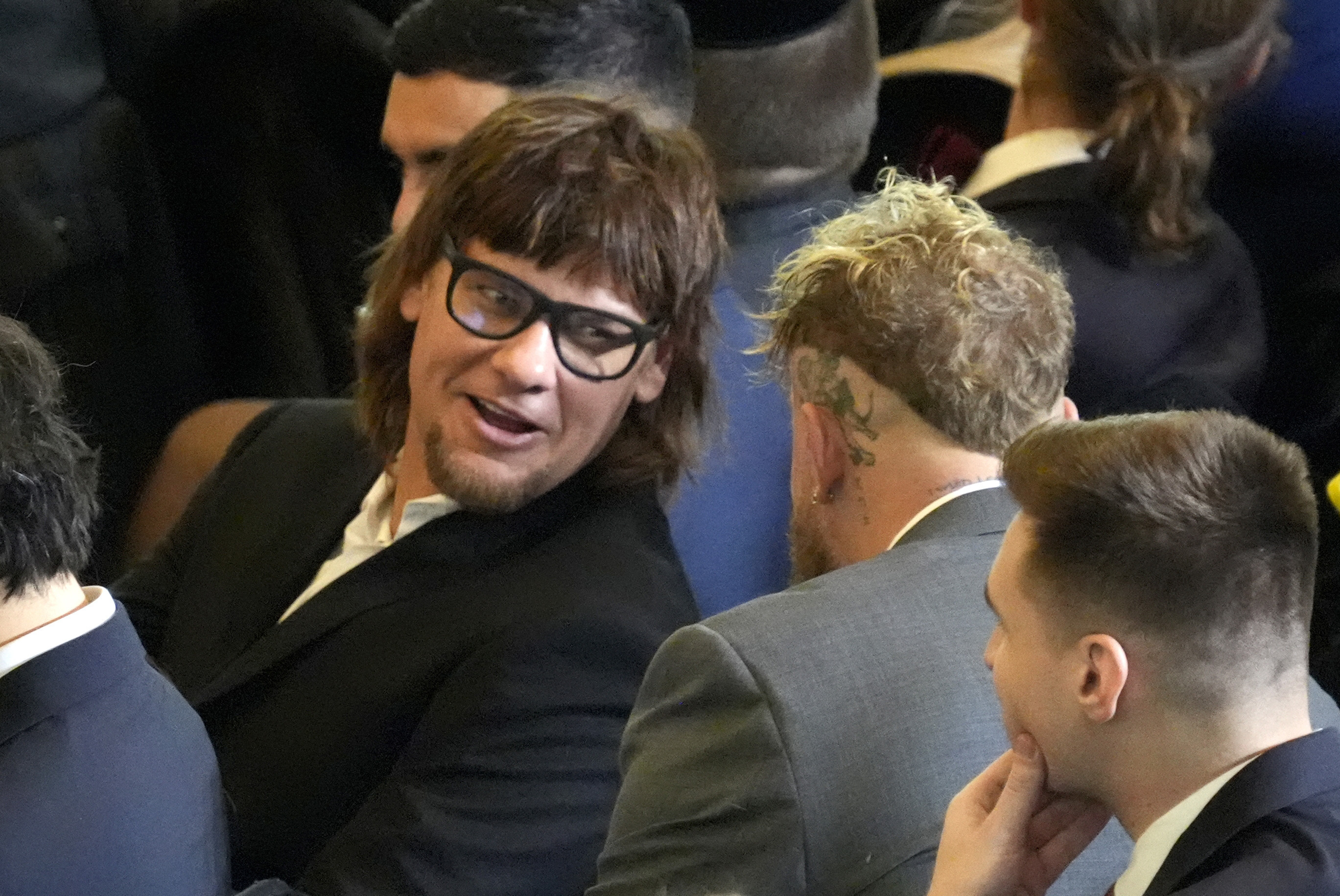 FILE - Theo Von, left speaks with Jake Paul in Emancipation Hall at the 60th Presidential Inauguration, Jan. 20, 2025, at the U.S. Capitol in Washington. (Jasper Colt/Pool Photo via AP, File)