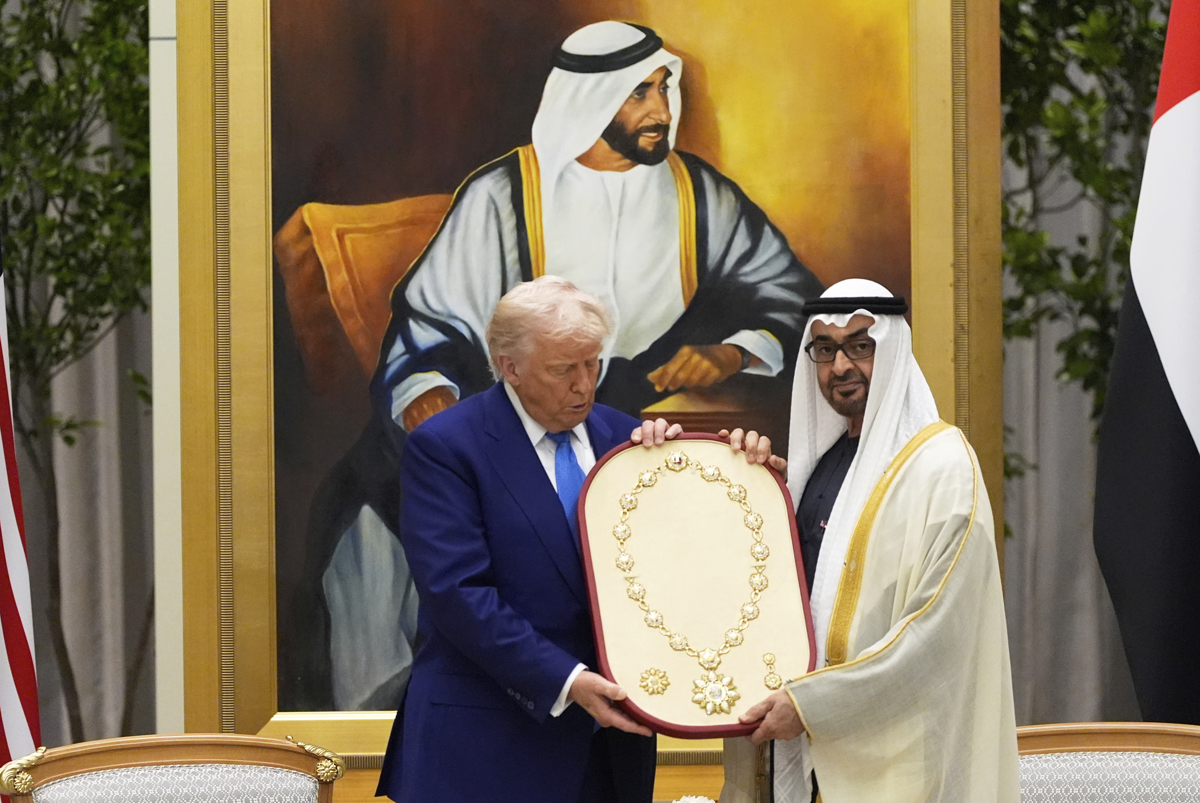 President Donald Trump is presented the Order of Zayed, the UAE highest civilian distinction, from UAE President Mohammed bin Zayed Al Nahyan at Qasr Al Watan, Thursday, May 15, 2025, in Abu Dhabi, United Arab Emirates. (AP Photo/Alex Brandon)
