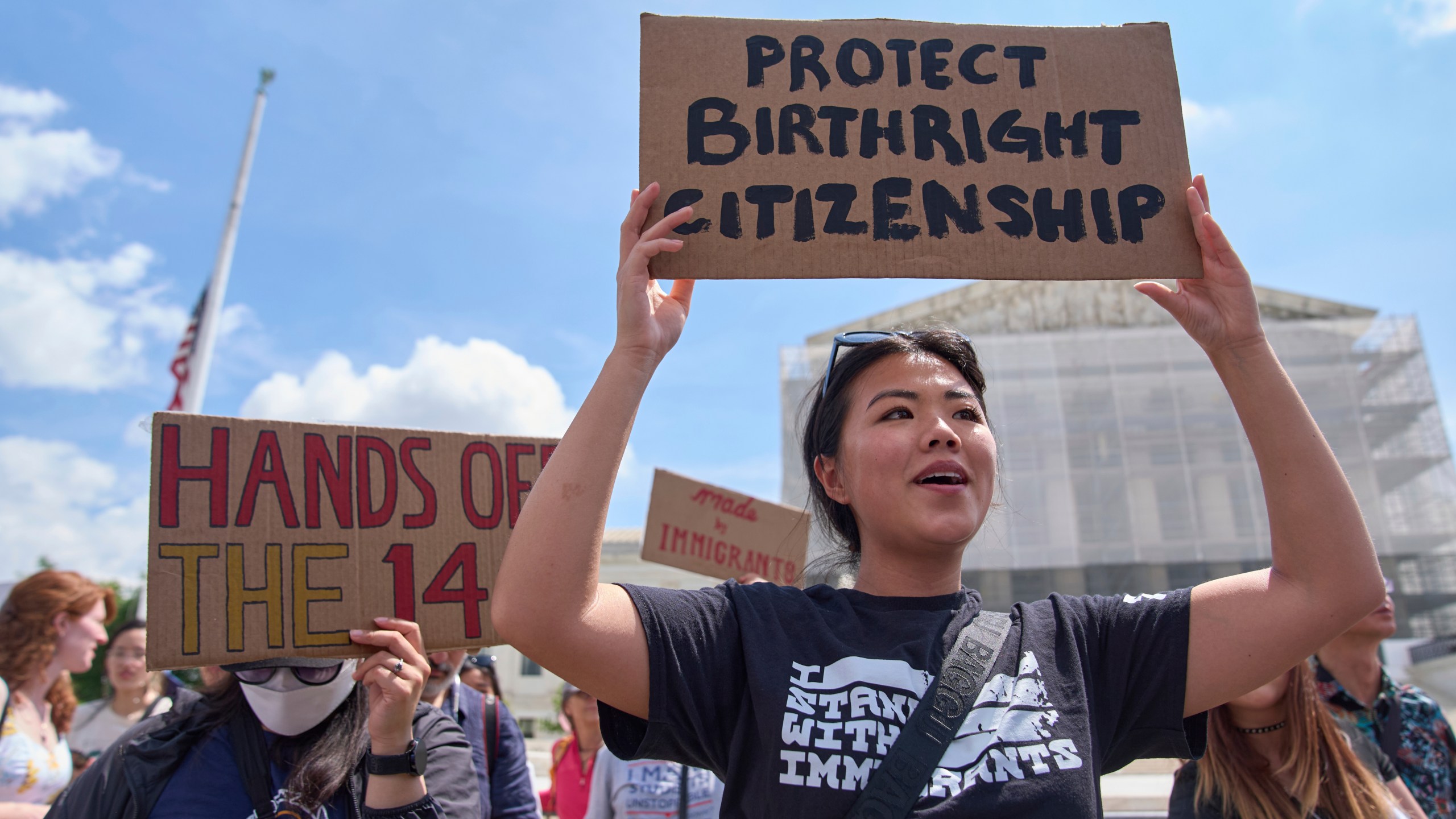 Hannah Liu, 26, of Washington, holds up a sign in support of birthright citizenship, Thursday, May 15, 2025, outside of the Supreme Court in Washington. "This is enshrined in the Constitution. My parents are Chinese immigrants," says Liu. "They came here on temporary visas so I derive my citizenship through birthright." (AP Photo/Jacquelyn Martin)