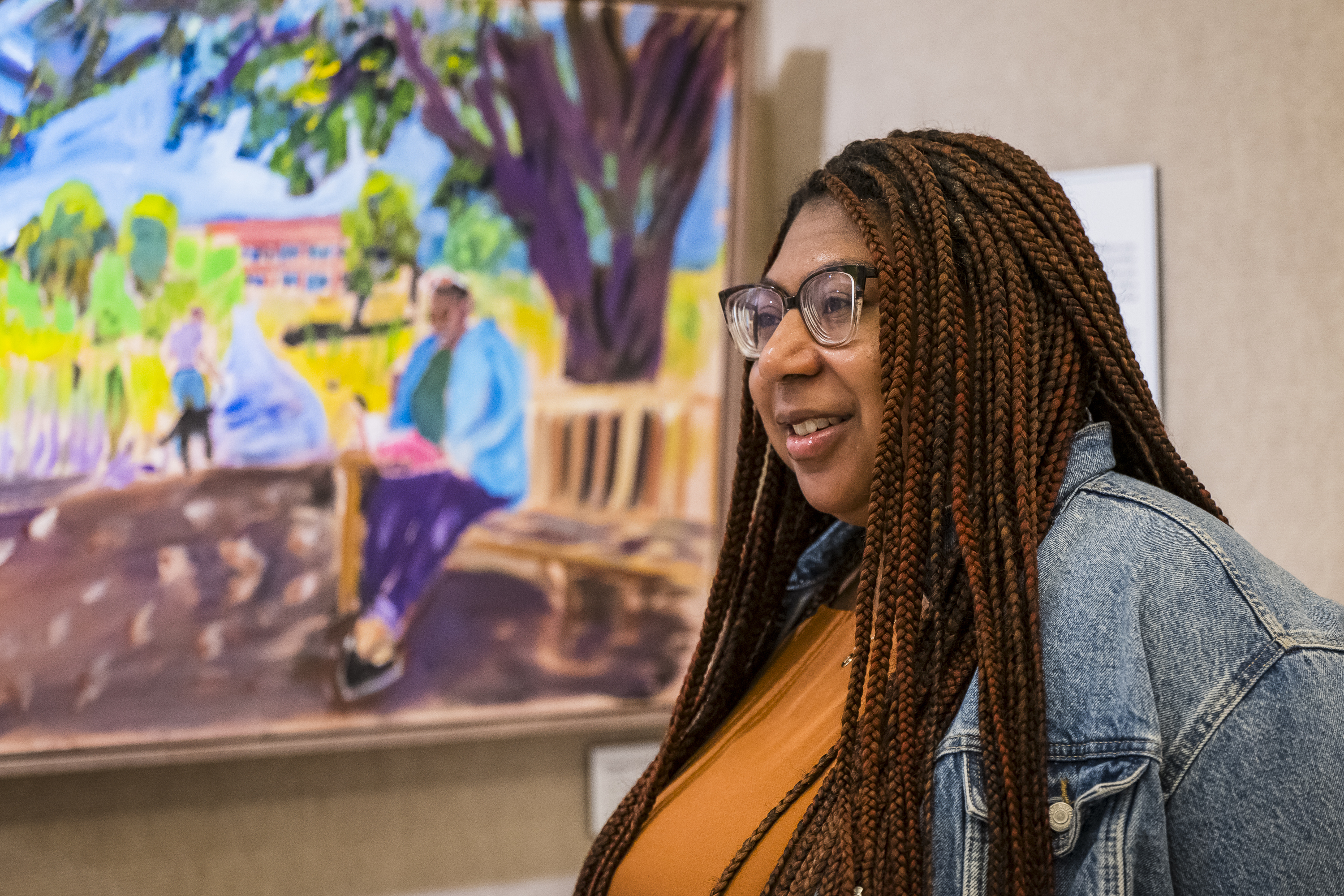 Devon Yarbrough, Digital Communications Manager at the George W. Bush Presidential Center, speaks about being part of one of the paintings by President George W. Bush on display in an exhibit at the George W. Bush Presidential Museum, Thursday, May 15, 2025, in Dallas. (AP Photo/Jessica Tobias)