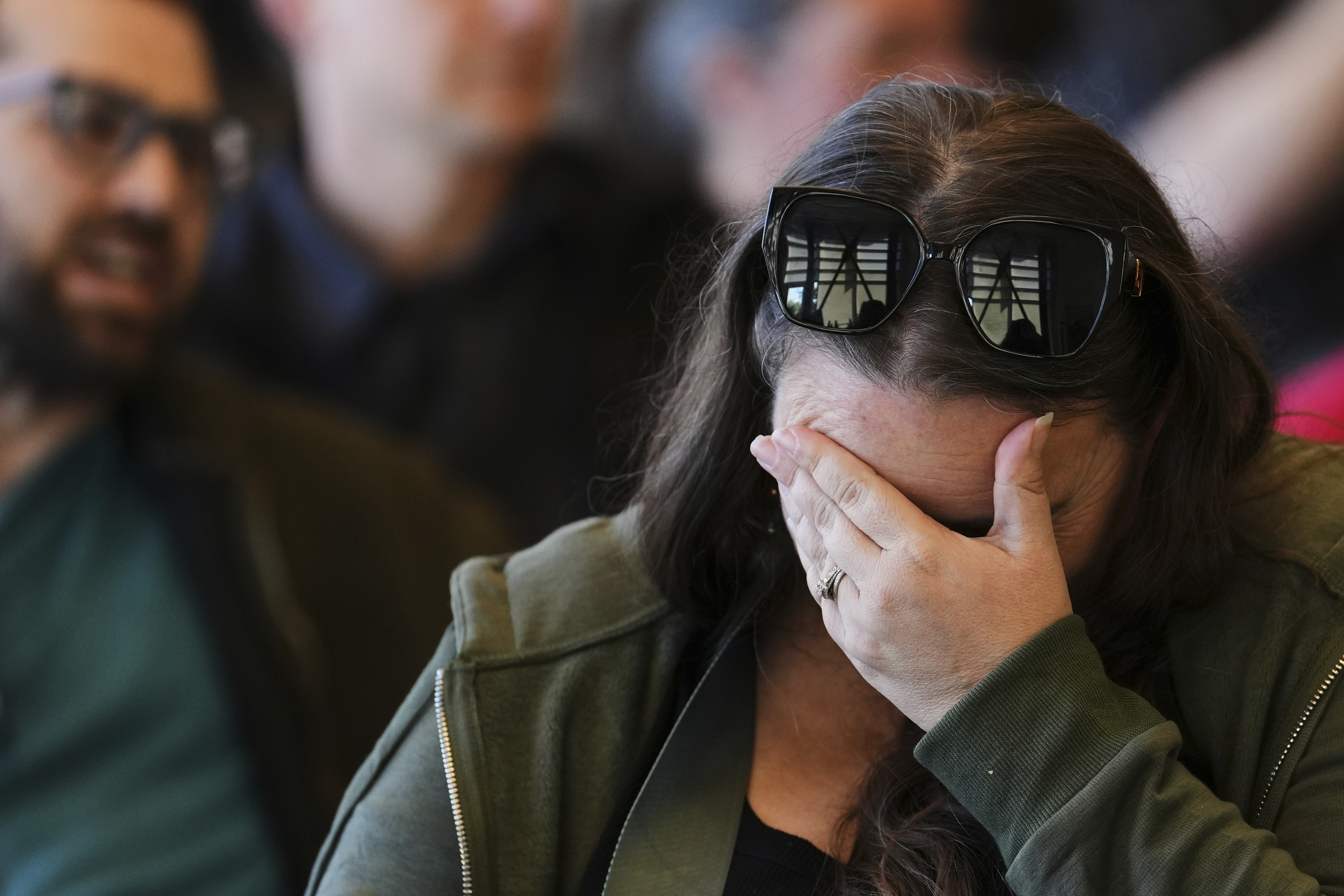 An attendee reacts during a town hall event with Rep. Marie Gluesenkamp Perez, D-Wash., at Centralia College Tuesday, April 22, 2025, in Centralia, Wash. (AP Photo/Lindsey Wasson)