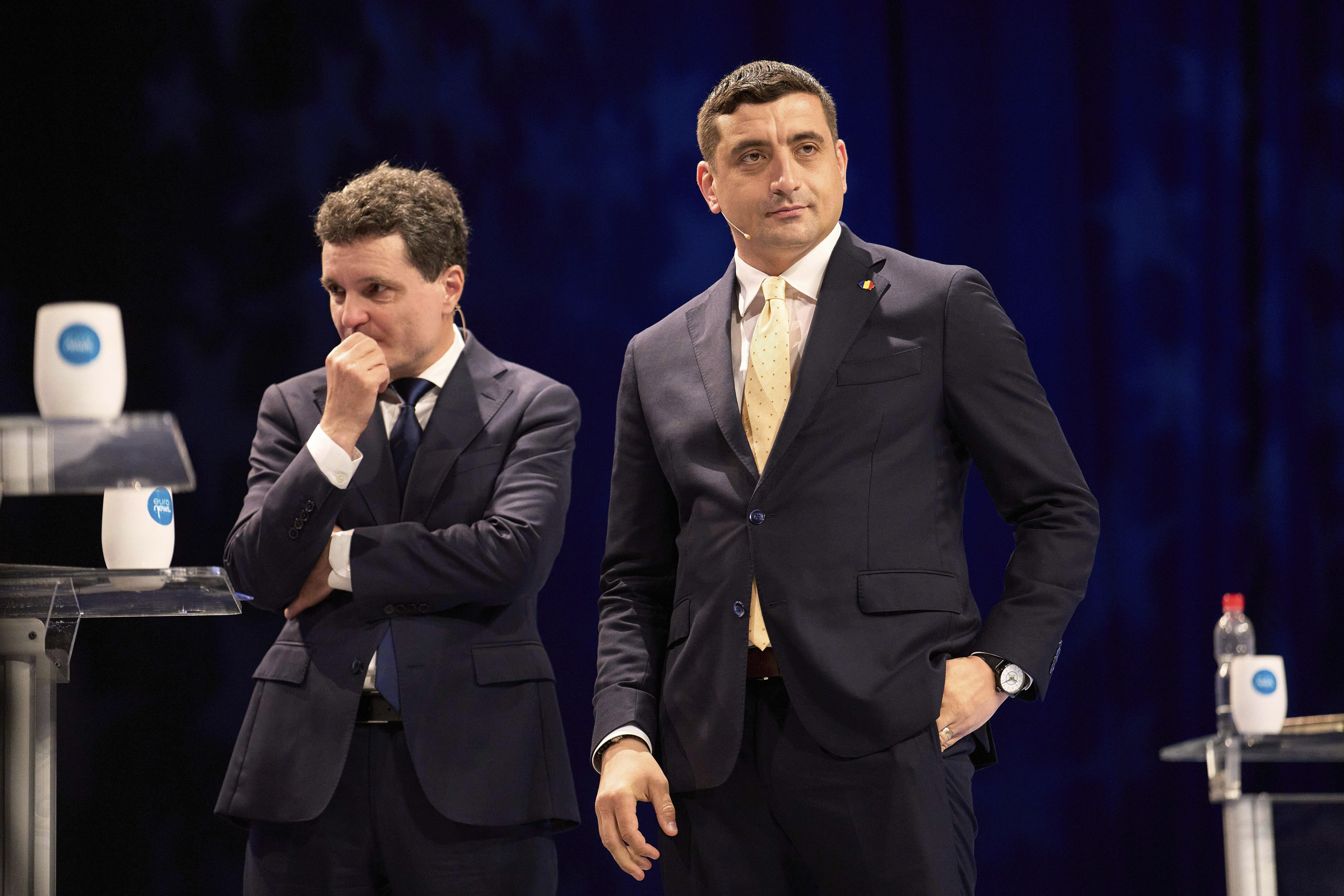 FILE - Presidential candidates Nicusor Dan, left, and George Simion take a break during a live electoral debate ahead of the second round of the country's presidential election redo in Bucharest, Romania, Thursday night, May 8, 2025. (AP Photo/Vadim Ghirda, File)