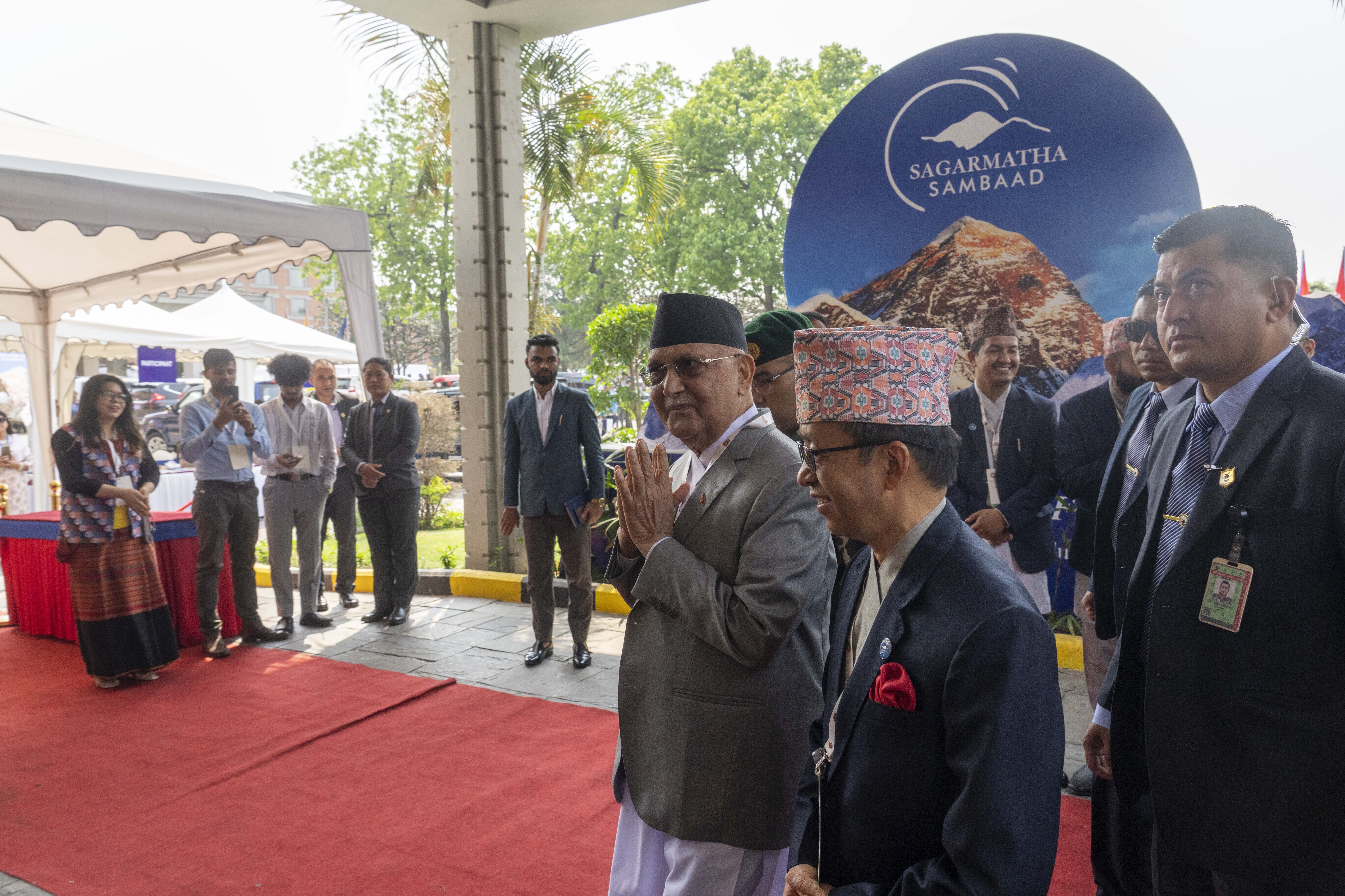 Nepalese Prime Minister Khadga Prasad Oli, center, arrives to participate in an environment conference named Sagarmatha Sambaad (Mount Everest Dialogue) in Kathmandu, Nepal, Friday, May 16, 2025. (AP Photo/Niranjan Shrestha)