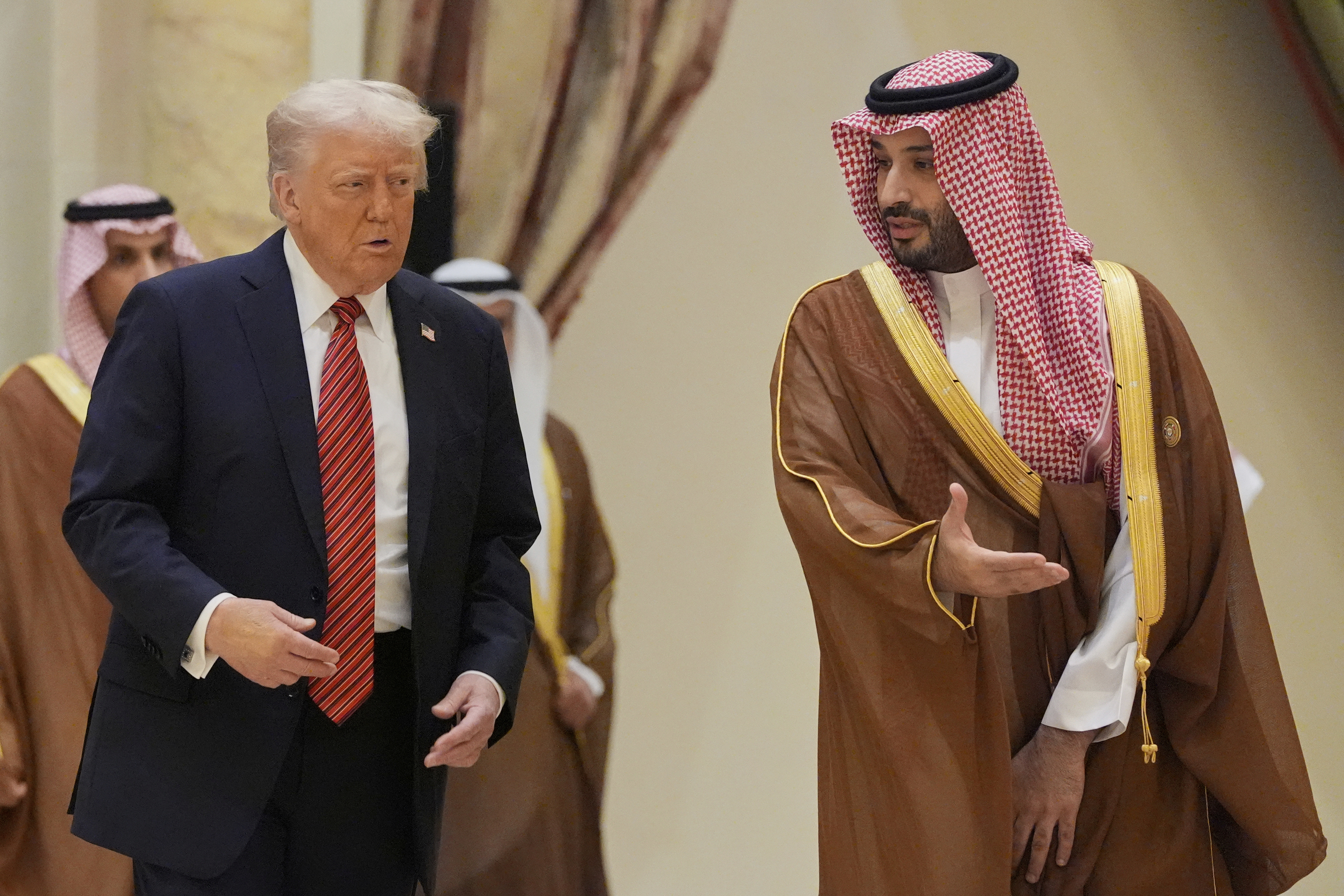 President Donald Trump arrives with Saudi Crown Prince Mohammed bin Salman for the group photo with Gulf Cooperation Council leaders during the GCC Summit in Riyadh, Saudi Arabia, Wednesday, May 14, 2025. (AP Photo/Alex Brandon)