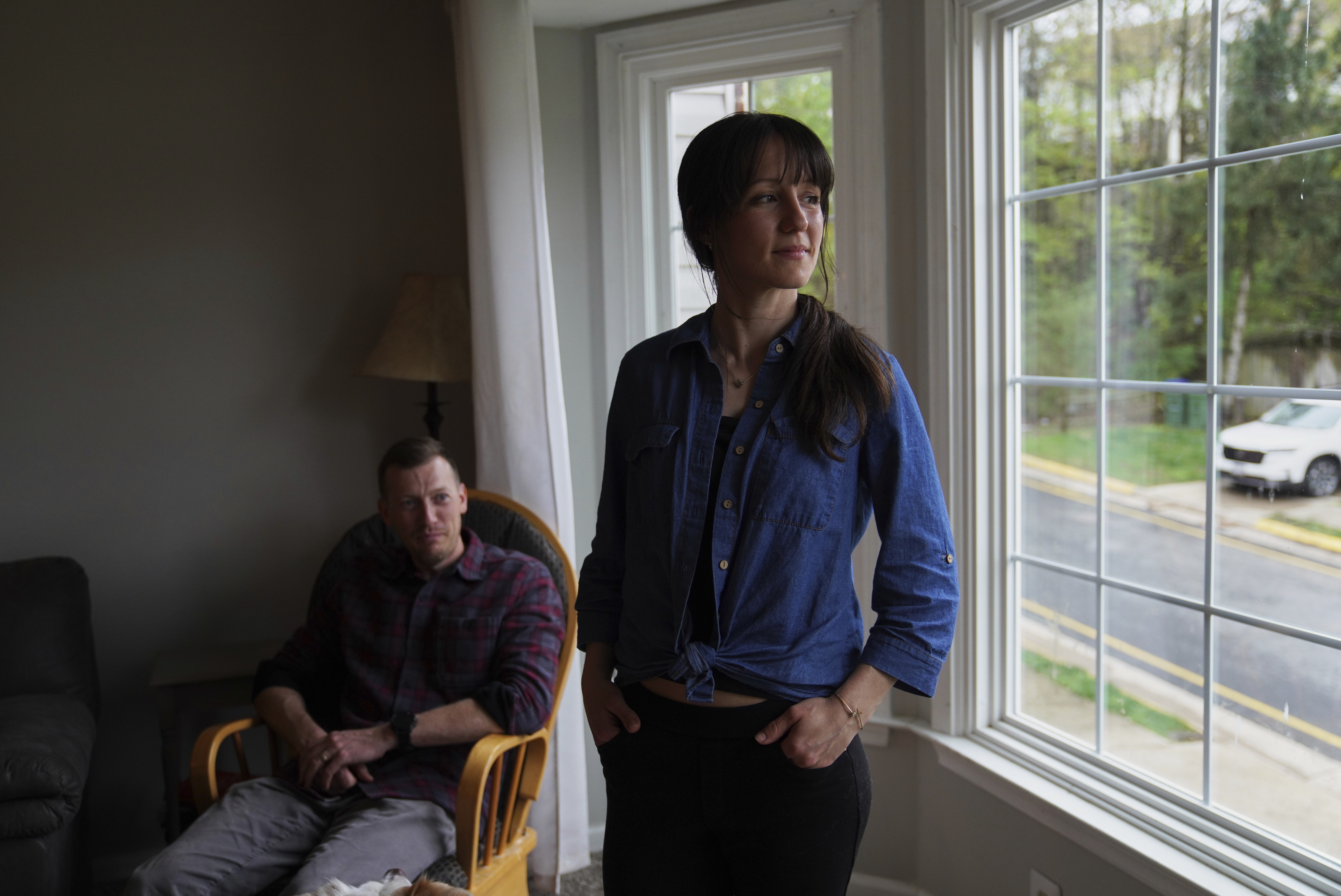 Phil Williams, a former Marine, and his wife Katlyn Williams pose for a portrait at their home in Stafford, Va., on Monday, April 7, 2025. (AP Photo/Jessie Wardarski)