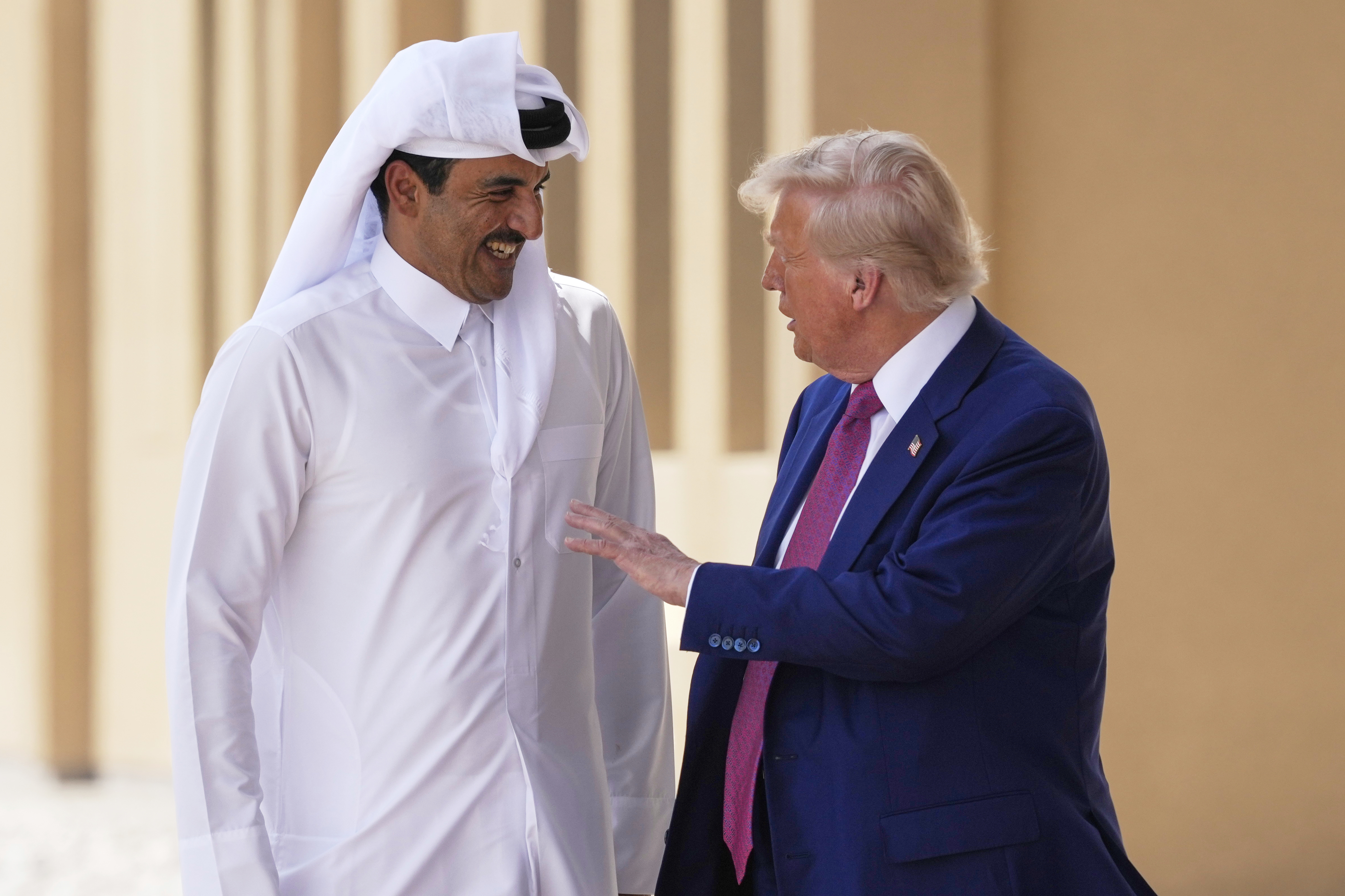 President Donald Trump and Qatar's Emir Sheikh Tamim bin Hamad Al Thani speak at Al Udeid Air Base, Thursday, May 15, 2025, in Doha, Qatar. (AP Photo/Alex Brandon)