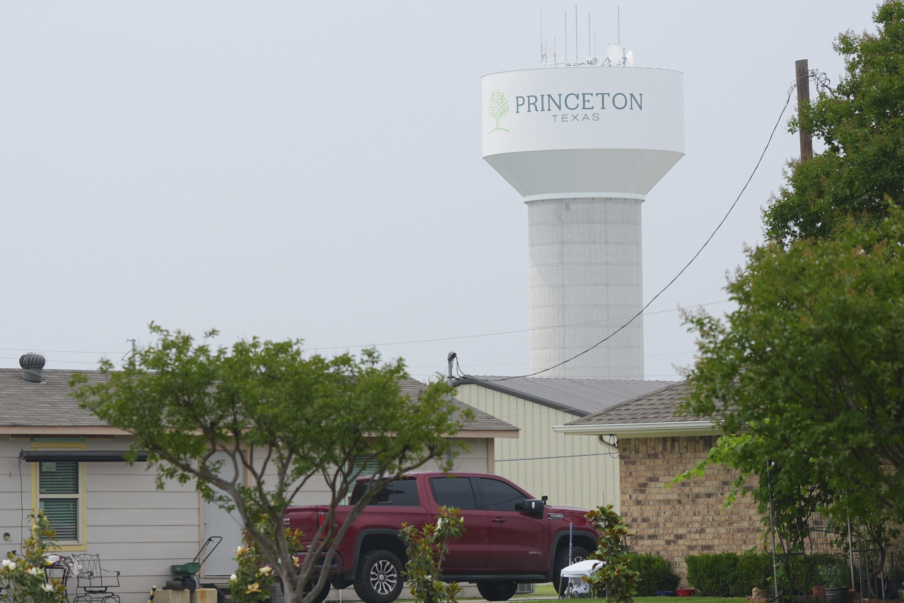 A water tower bears the name of the town, Princeton, Texas, Friday, May 16, 2025. (AP Photo/LM Otero)