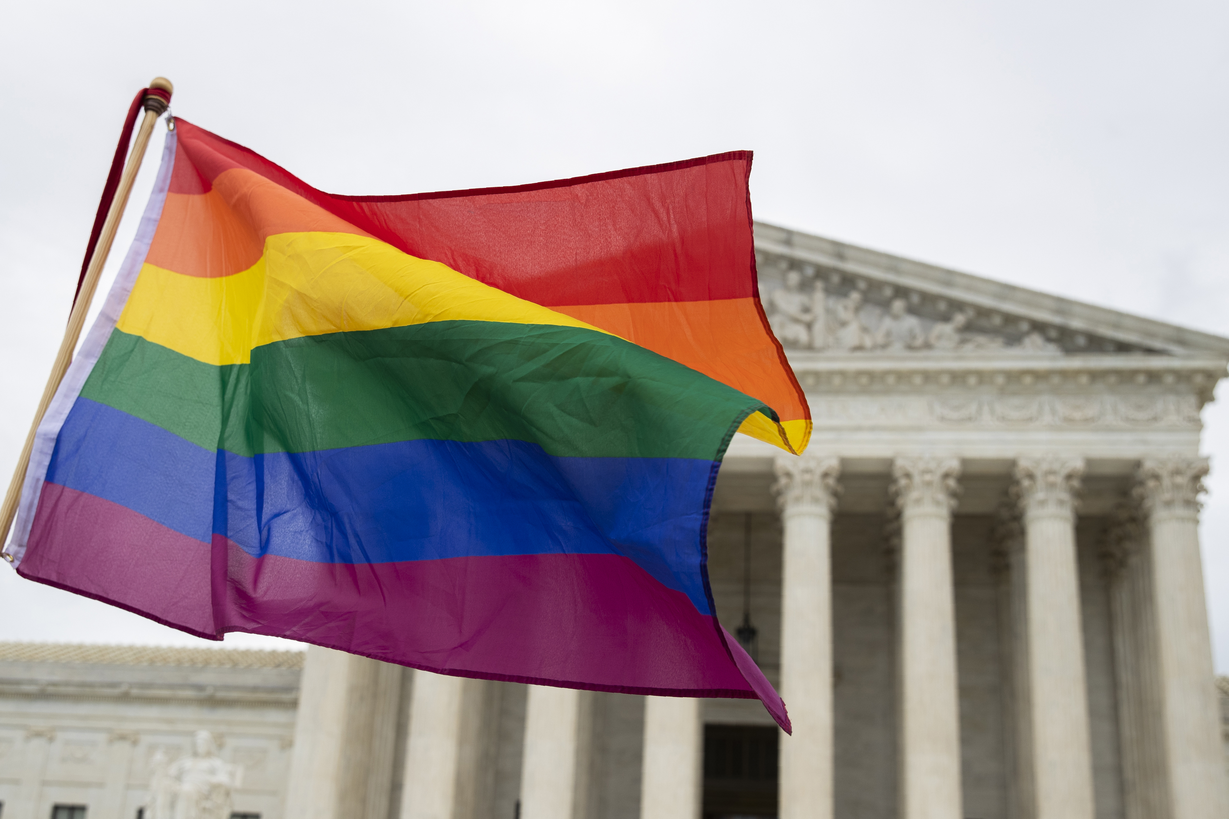 FILE - A pride flag is seen in front of the U.S. Supreme Court, Oct. 8, 2019, in Washington. (AP Photo/Manuel Balce Ceneta, File)