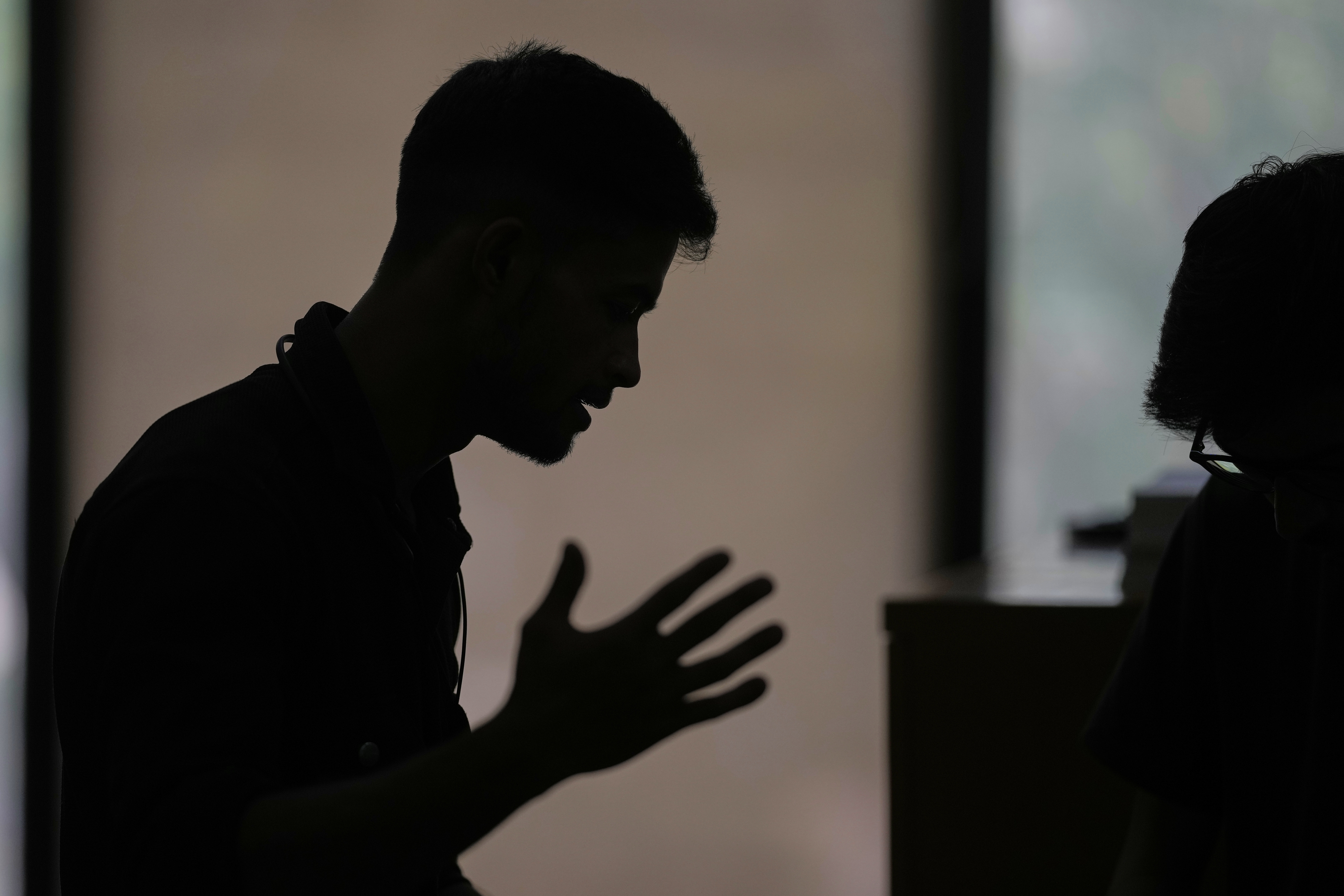 A Rohingya refugee who has not been identified due to safety concerns, talks to The Associated Press in New Delhi, India, about how his family was deported to an island in Myanmar, Friday, May 16, 2025. (AP Photo/Manish Swarup)