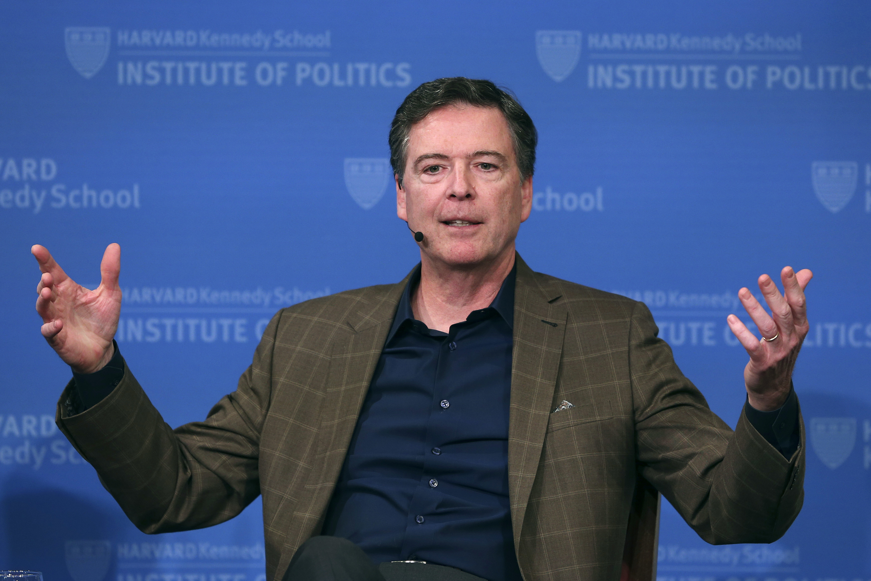 FILE - Former FBI director James Comey gestures while speaking at Harvard University's Institute of Politics' JFK Jr. Forum in Cambridge, Mass., Feb. 24, 2020. (AP Photo/Charles Krupa, File)