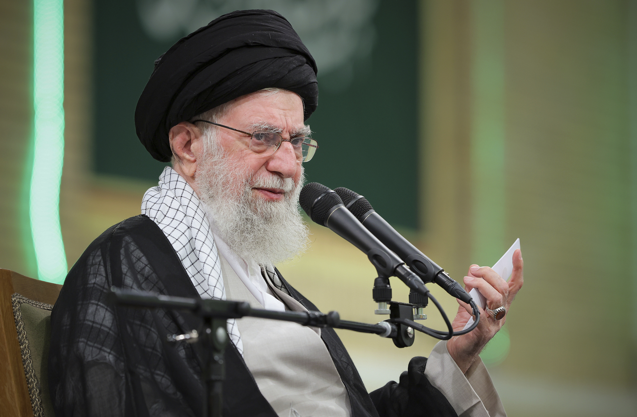 In this photo released by an official website of the office of the Iranian supreme leader, Supreme Leader Ayatollah Ali Khamenei speaks during a meeting with teachers, in Tehran, Iran, Saturday, May 17, 2025. (Office of the Iranian Supreme Leader via AP)