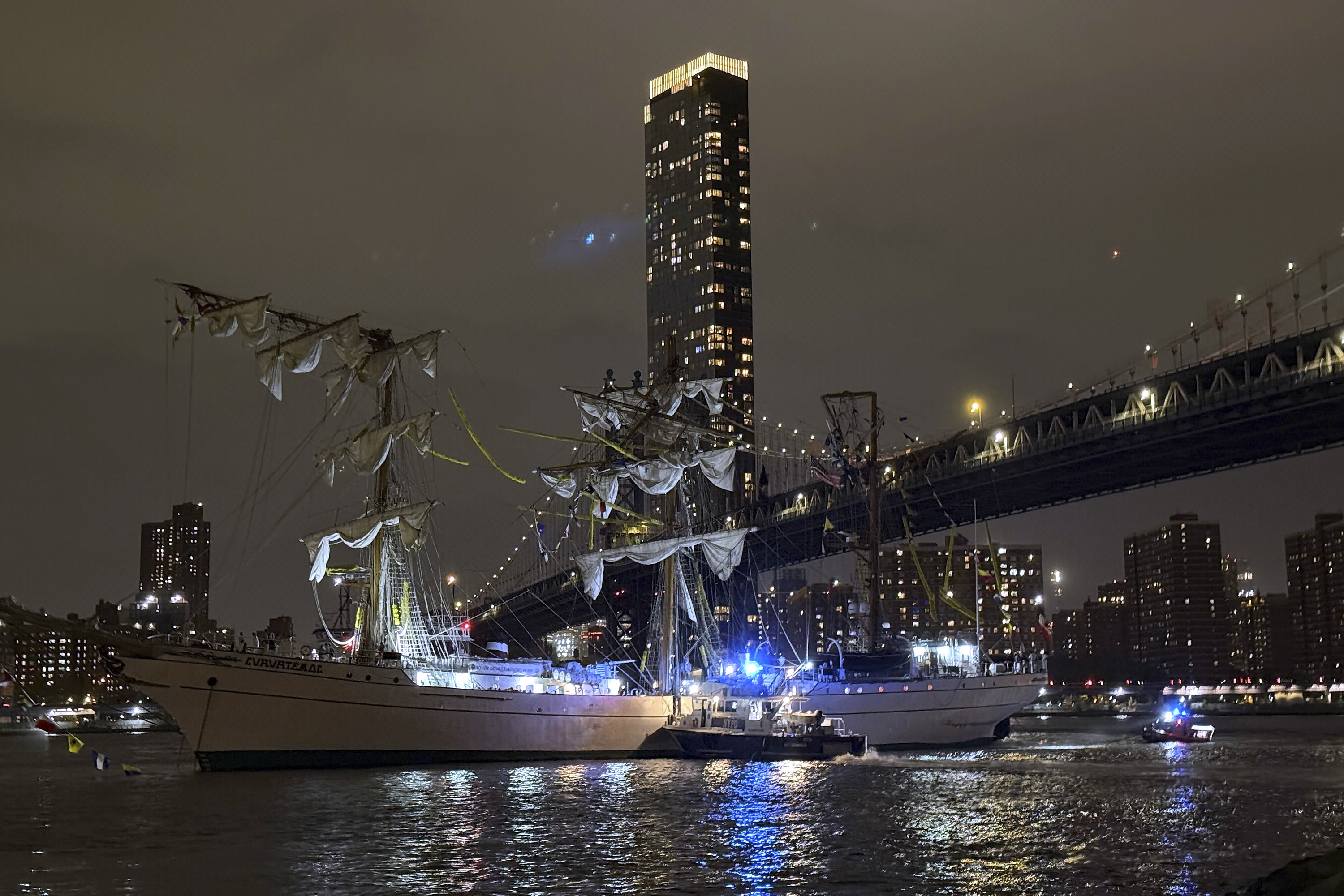 A masted Mexican Navy training ship, the Cuauhtémoc, sits stranded after colliding with the Brooklyn Bridge in New York on Saturday, May 17, 2025. (AP Photo/Kyle Viterbo)
