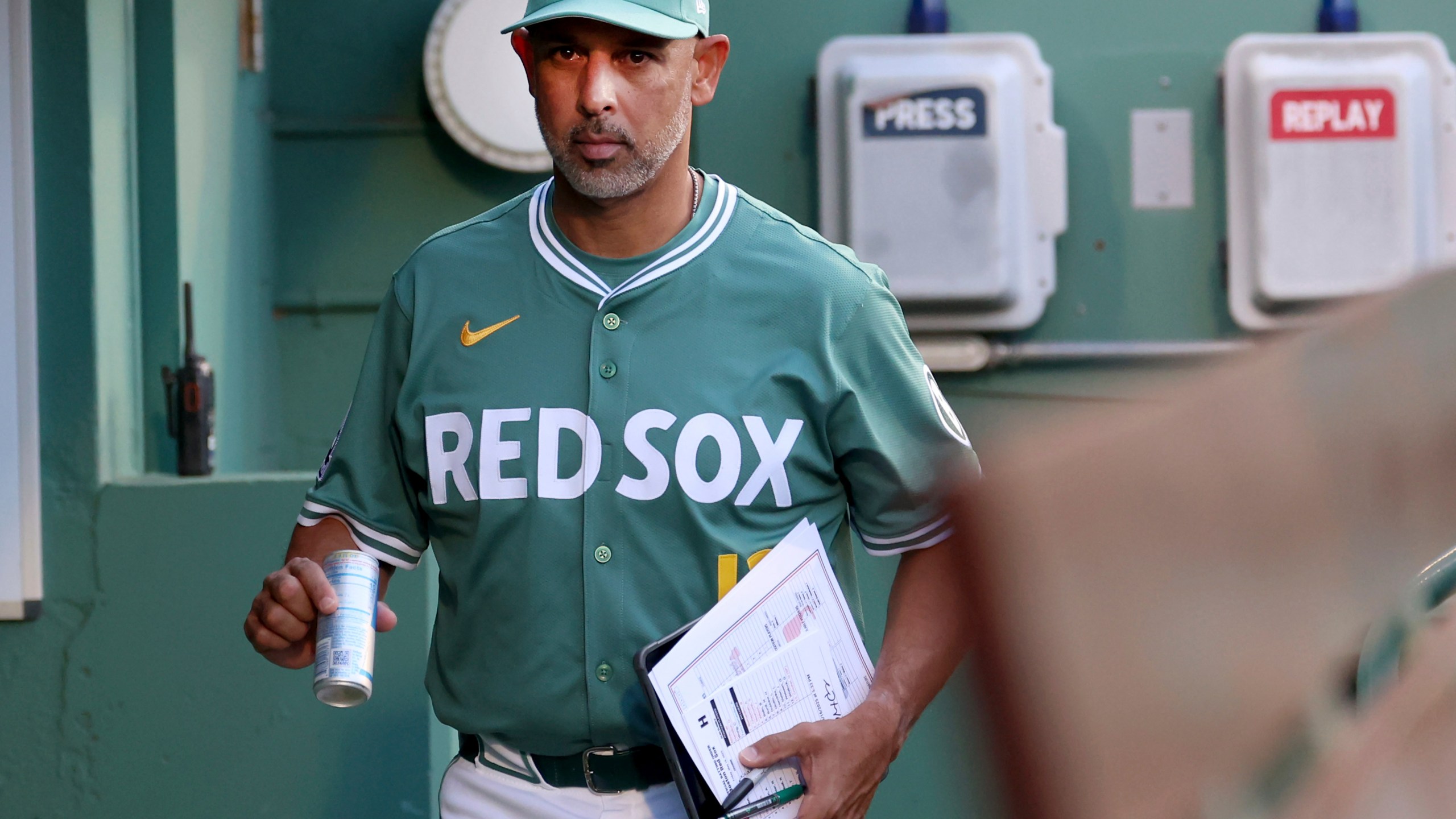 Boston Red Sox manager Alex Cora enters the dugout before a baseball game against the Atlanta Braves, Friday, May 16, 2025, in Boston. (AP Photo/Mark Stockwell)