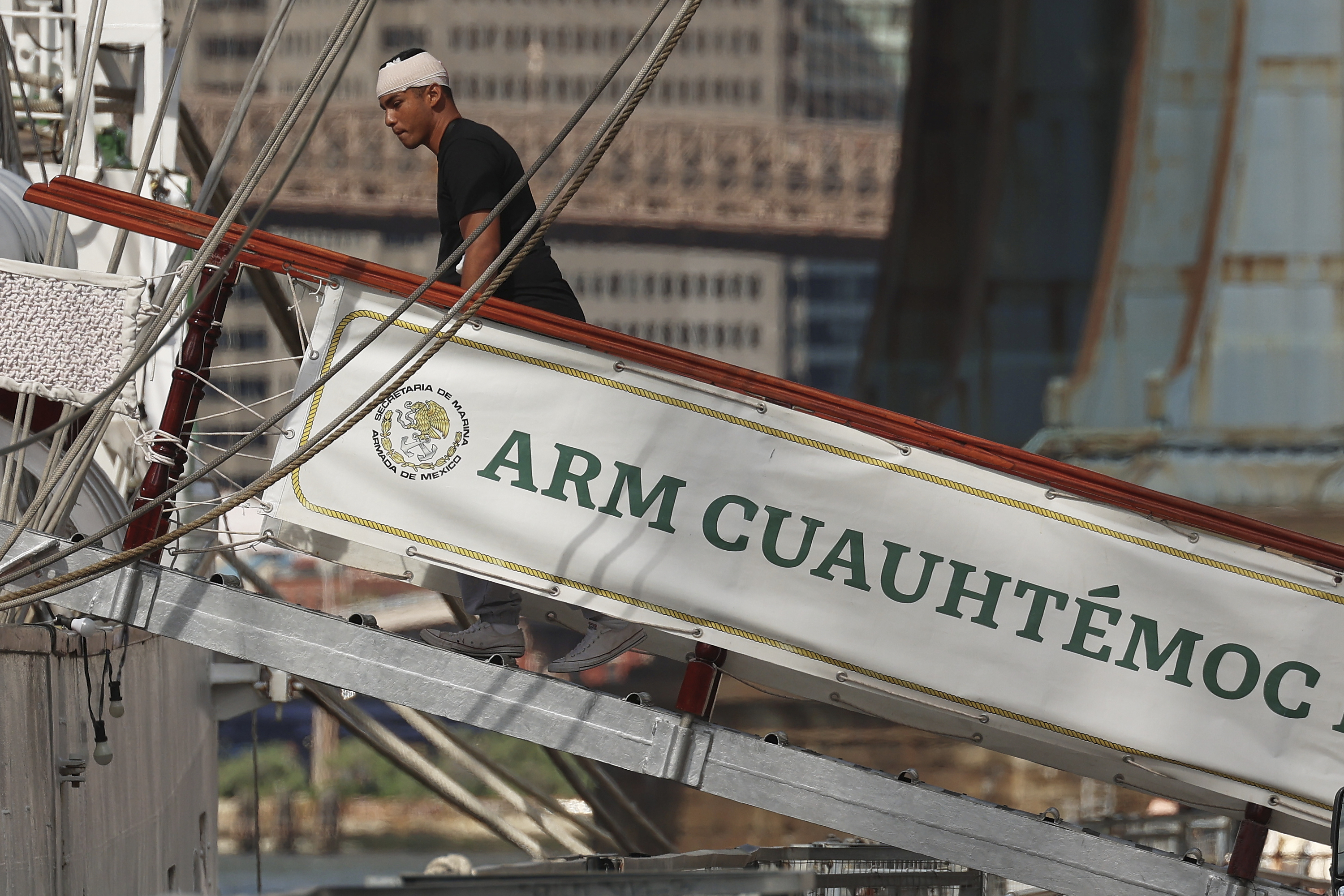 A sailor arrives back at the Cuauhtémoc, Sunday, May 18, 2025 in New York, a masted Mexican Navy training ship that collided with the Brooklyn Bridge the night before. (AP Photo/Yuki Iwamura)