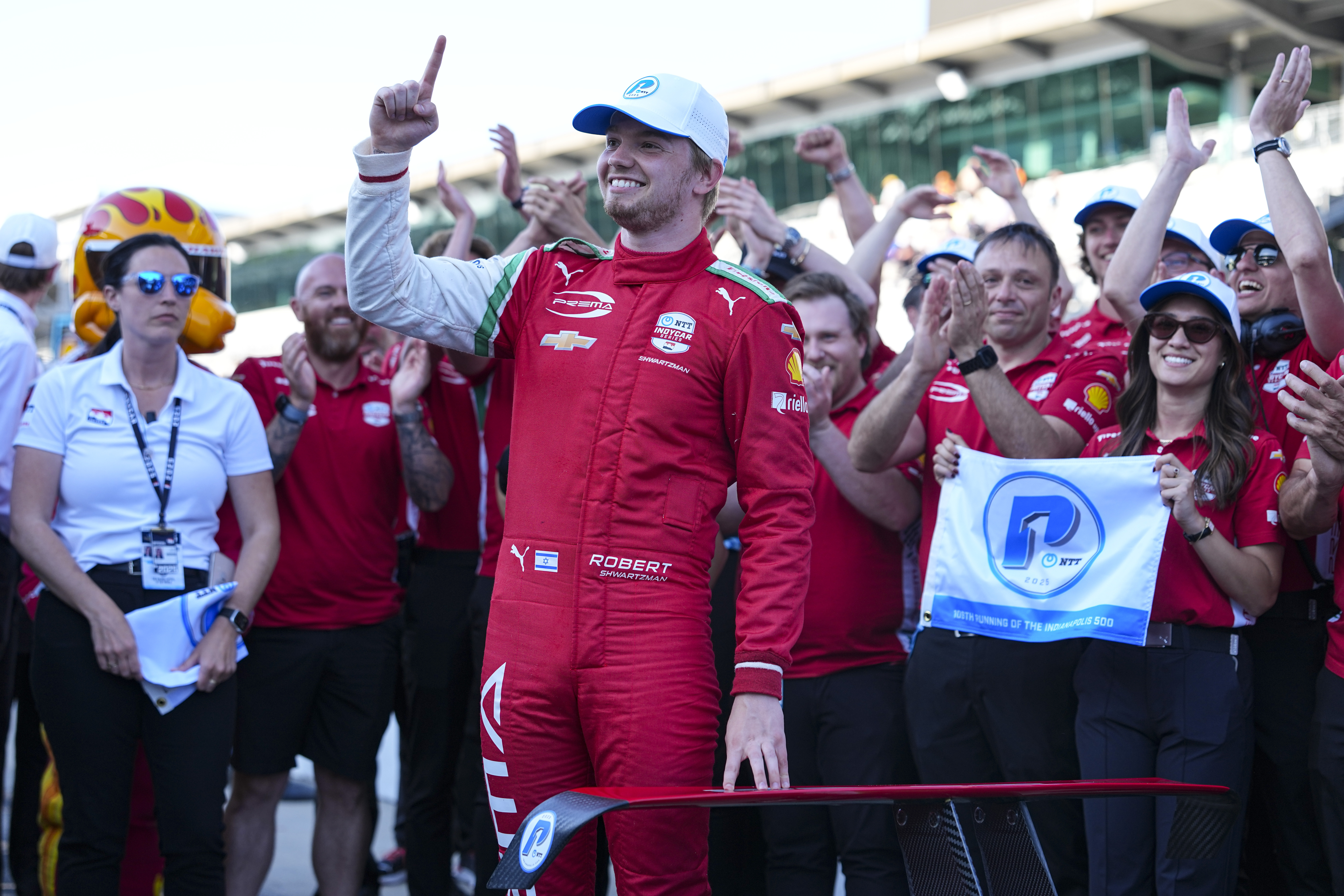 Robert Shwartzman, of Israel, celebrates after winning the pole position during qualifications for the Indianapolis 500 auto race at Indianapolis Motor Speedway in Indianapolis, Sunday, May 18, 2025. (AP Photo/Michael Conroy)