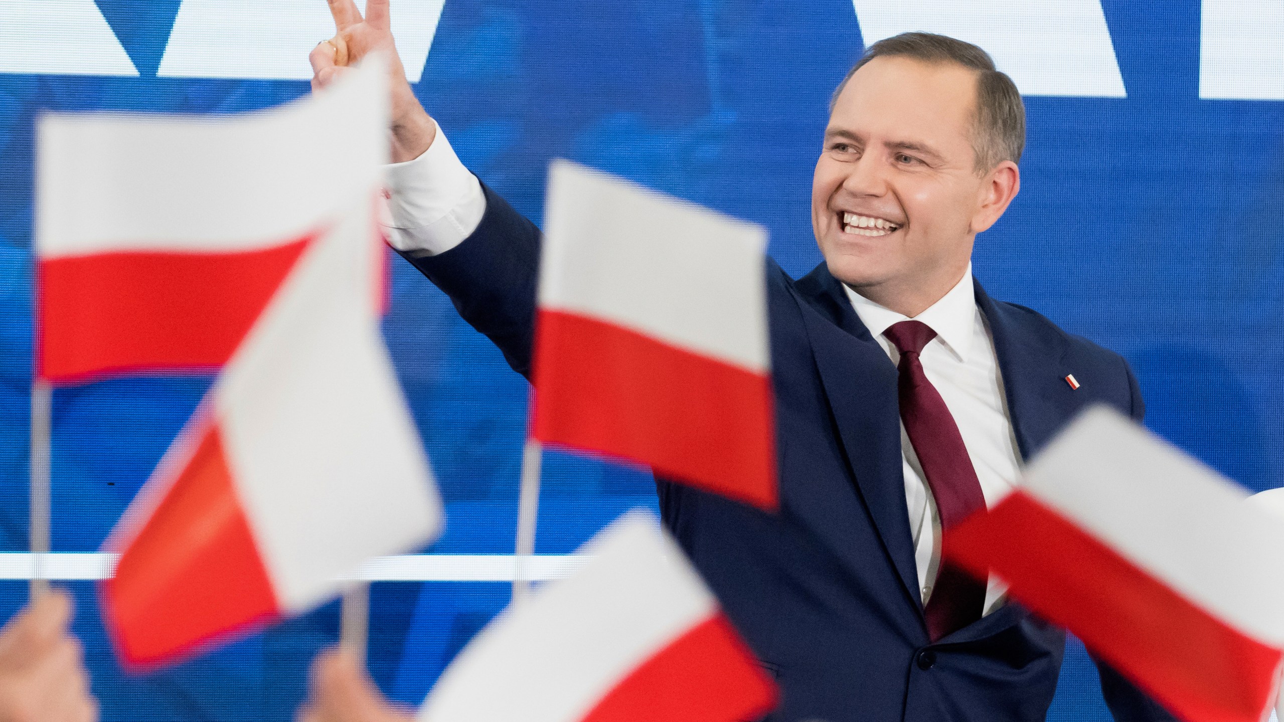Karol Nawrocki, presidential candidate for the 2025 Polish presidential election supported by Poland's national conservative Law and Justice party, waves to supporters as first exit polls following presidential elections are announced in Gdansk, Poland, Sunday, May 18, 2025. (AP Photo/Wojciech Strozyk)