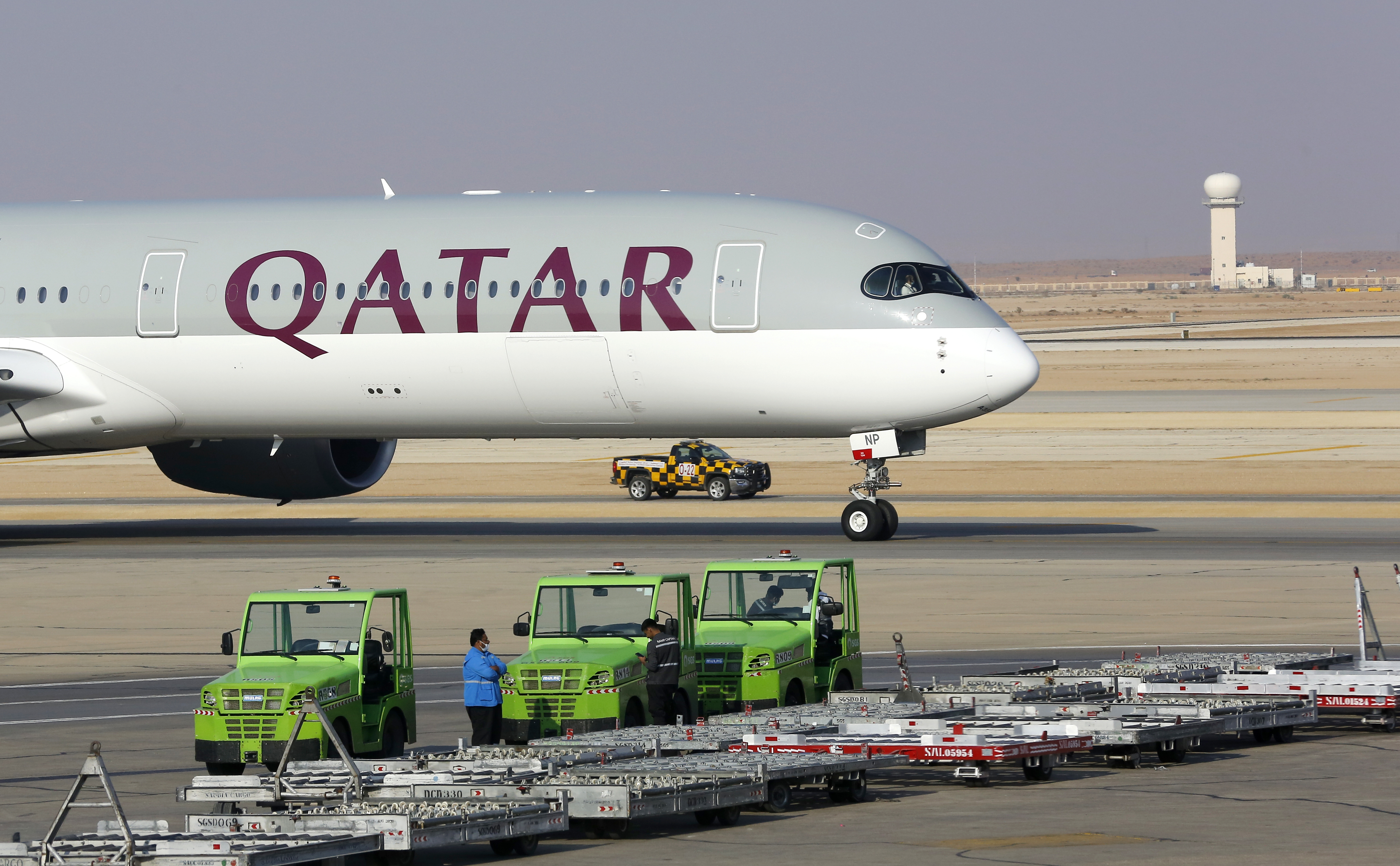 FILE - The first Qatar Airways plane in three years lands at King Khalid Airport in Riyadh, Saudi Arabia, Monday, Jan. 11, 2021.(AP Photo/Amr Nabil, File)