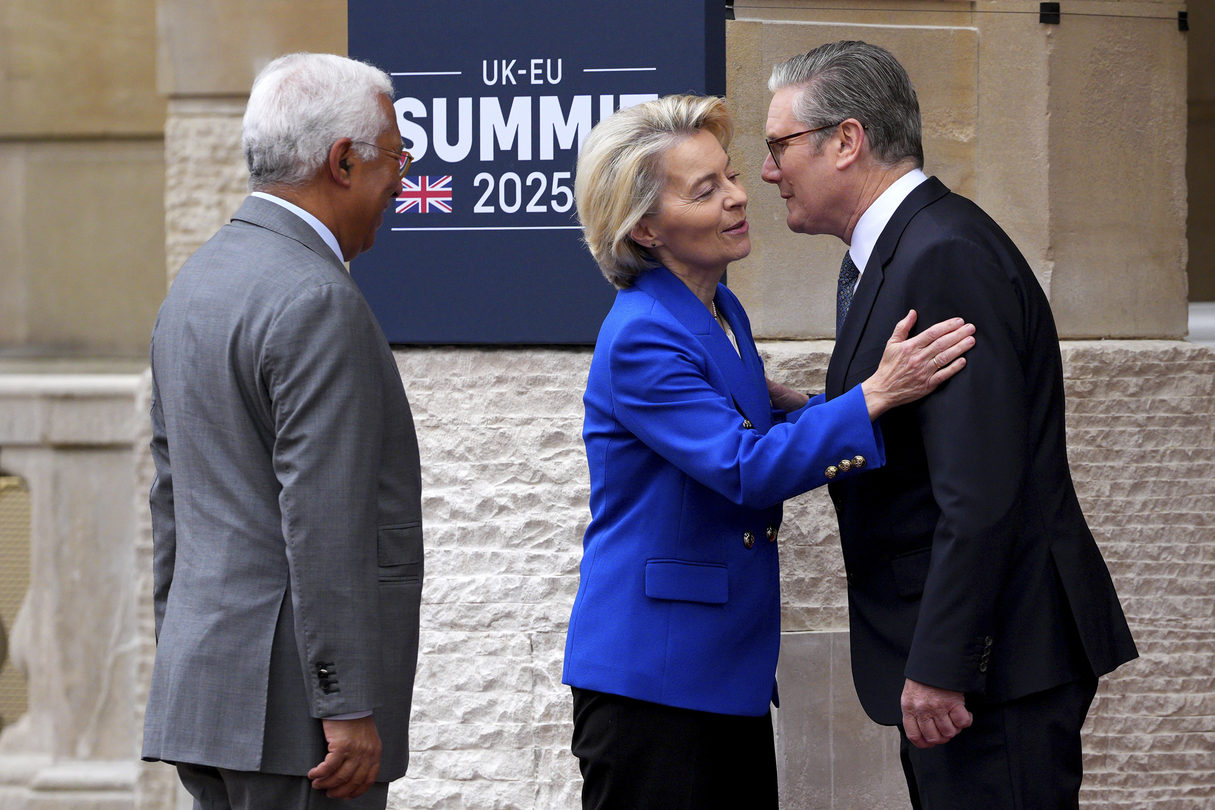 Britain's Prime Minister Keir Starmer, right, greets European Commission President Ursula von der Leyen as she arrives with European Council President Antonio Costa to attend a United Kingdom and European Union summit at Lancaster House, London, Monday, May 19, 2025. (Carl Court/Pool Photo via AP)