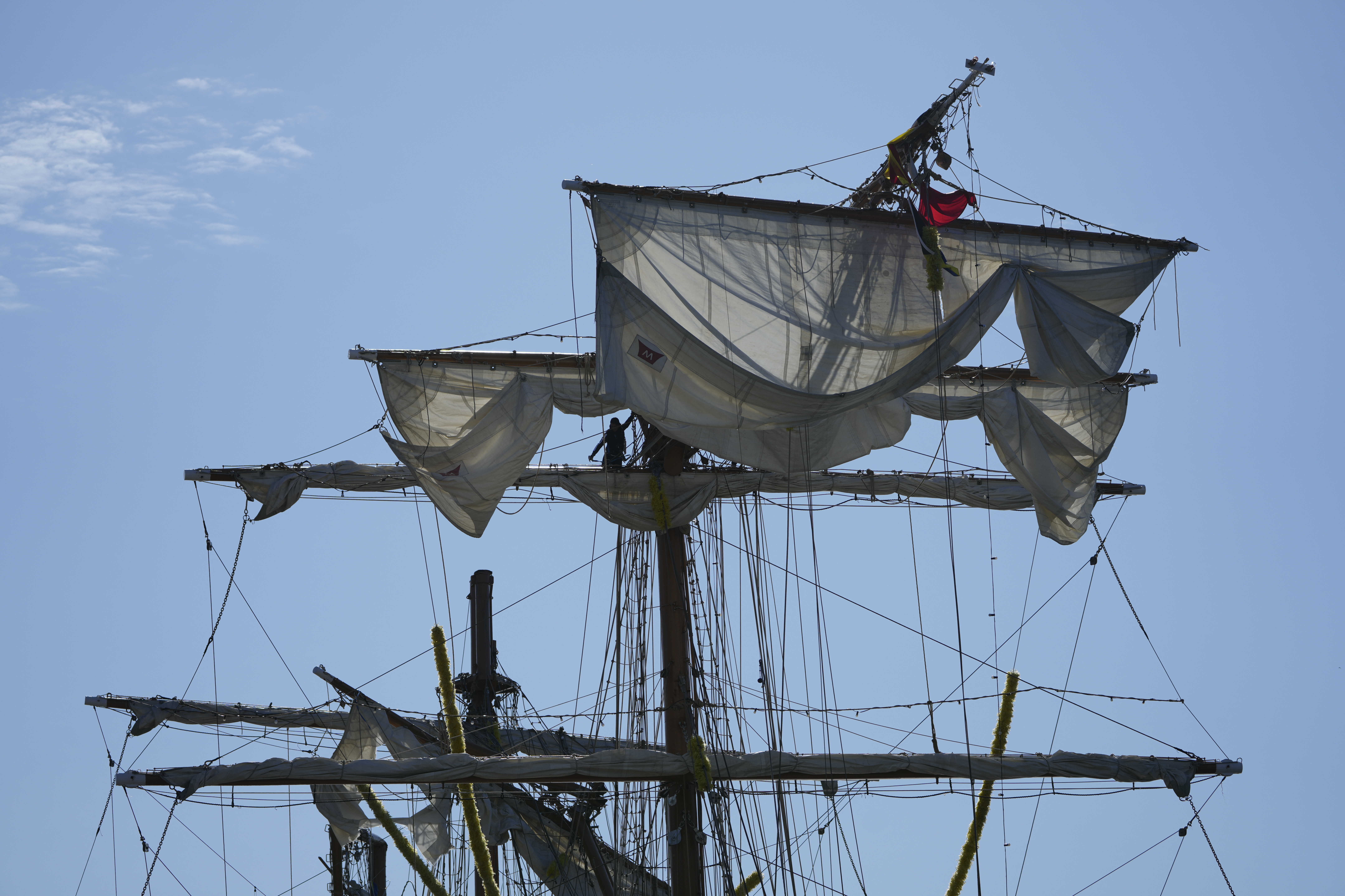 People work the Cuauhtemoc, a masted Mexican Navy training ship, after it collided with the Brooklyn Bridge in New York, Monday, May 19, 2025. (AP Photo/Seth Wenig)