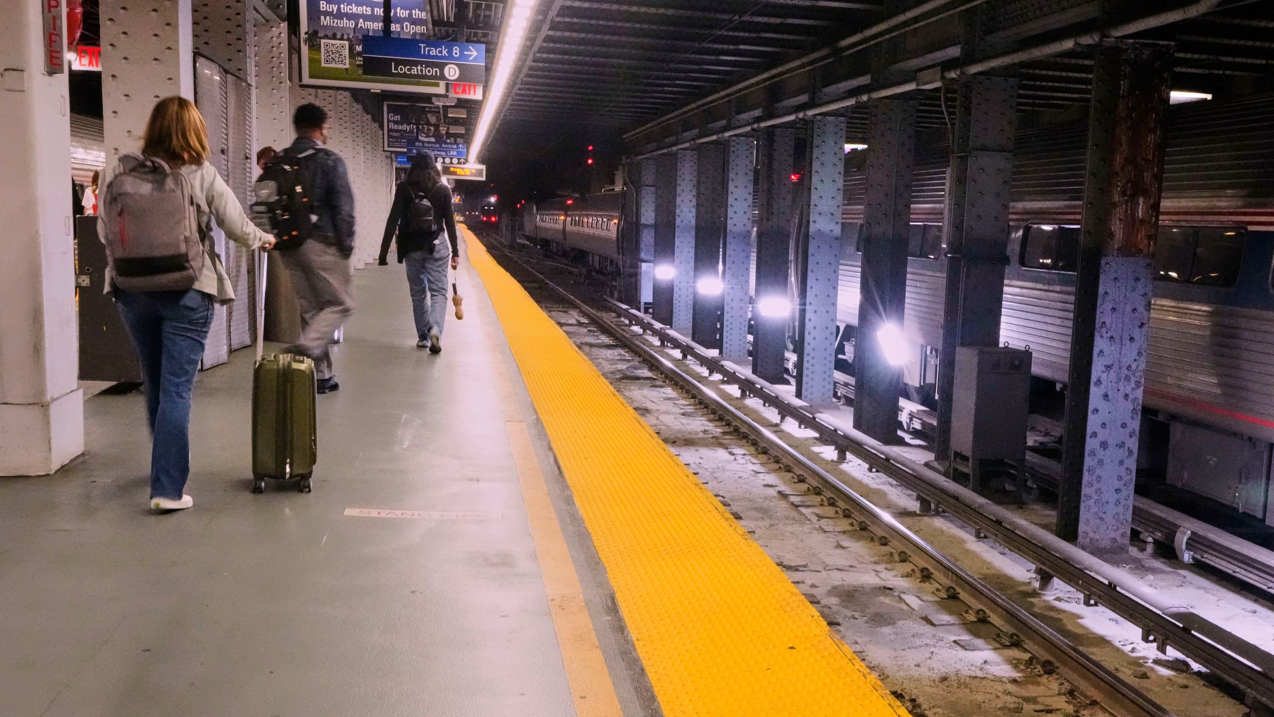 Amtrak passengers arrive at Penn Station in New York, Friday, May 16, 2025. (AP Photo/Richard Drew)