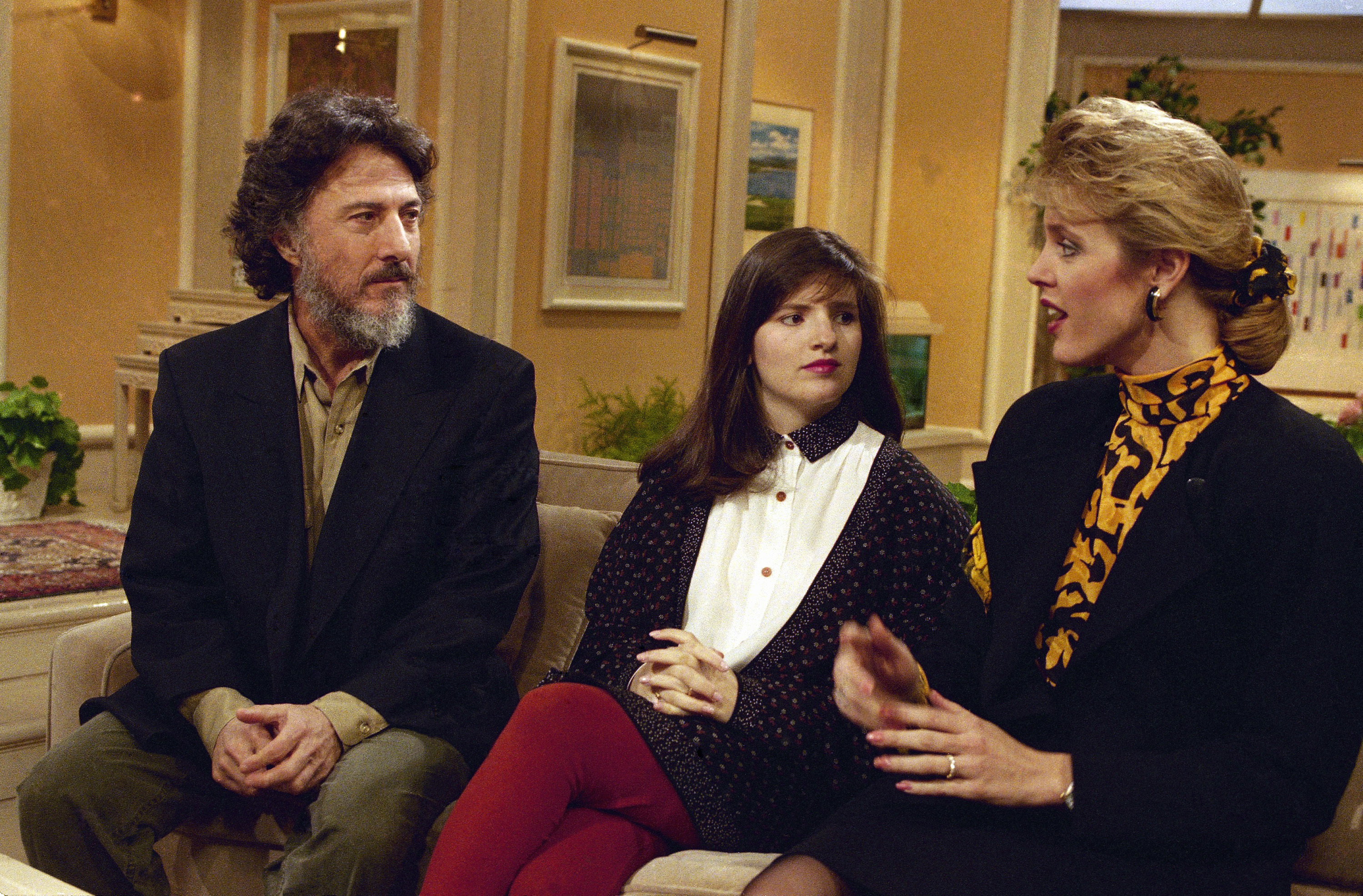 FILE - Actor Dustin Hoffman and Allison Atlas talk with Deborah Norville, at right, while taping a spot on the NBC "Today Show" in New York, February 28, 1990. (AP Photo/Marty Lederhandler, File)