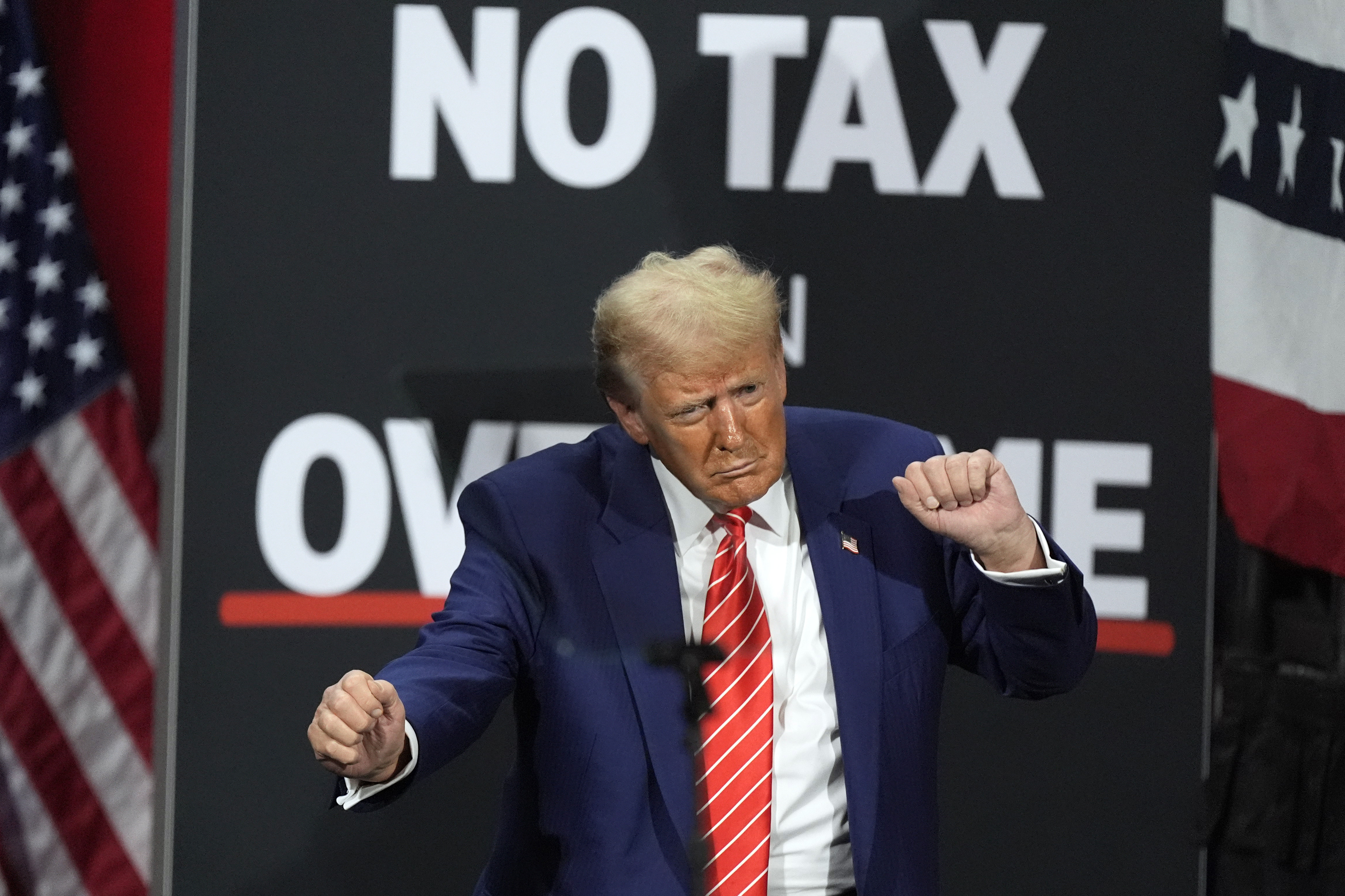FILE - Republican presidential nominee former President Donald Trump dances at a campaign event at the Cobb Energy Performing Arts Centre, Oct. 15, 2024, in Atlanta. (AP Photo/John Bazemore, File)