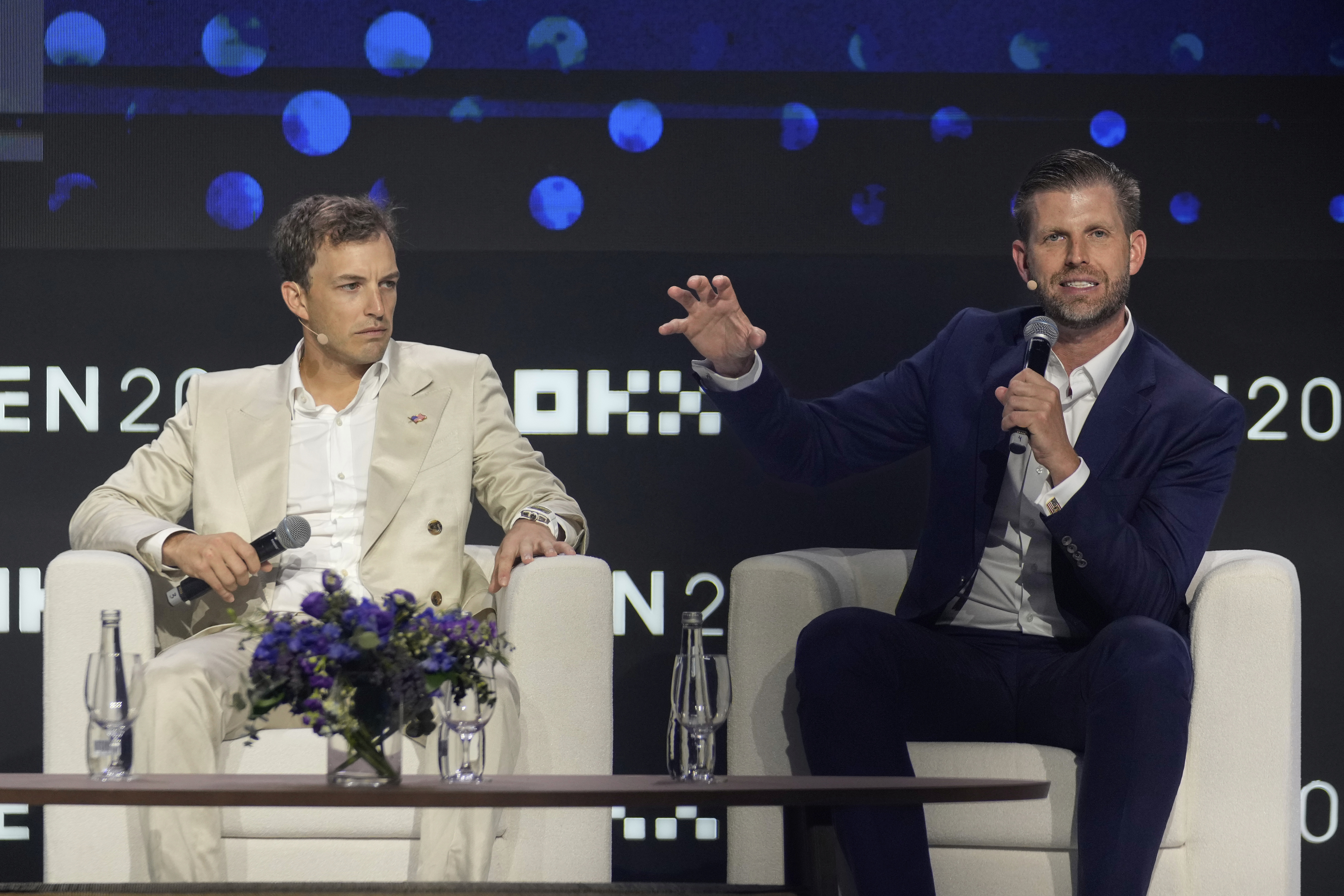 Eric Trump, Executive VP of The Trump Organization, right, speaks as Co-founder of World Liberty Financial Zach Witkoff looks on during Token 2049, a Crypto event, in Dubai, United Arab Emirates, Thursday, May 1, 2025. (AP Photo/Altaf Qadri)
