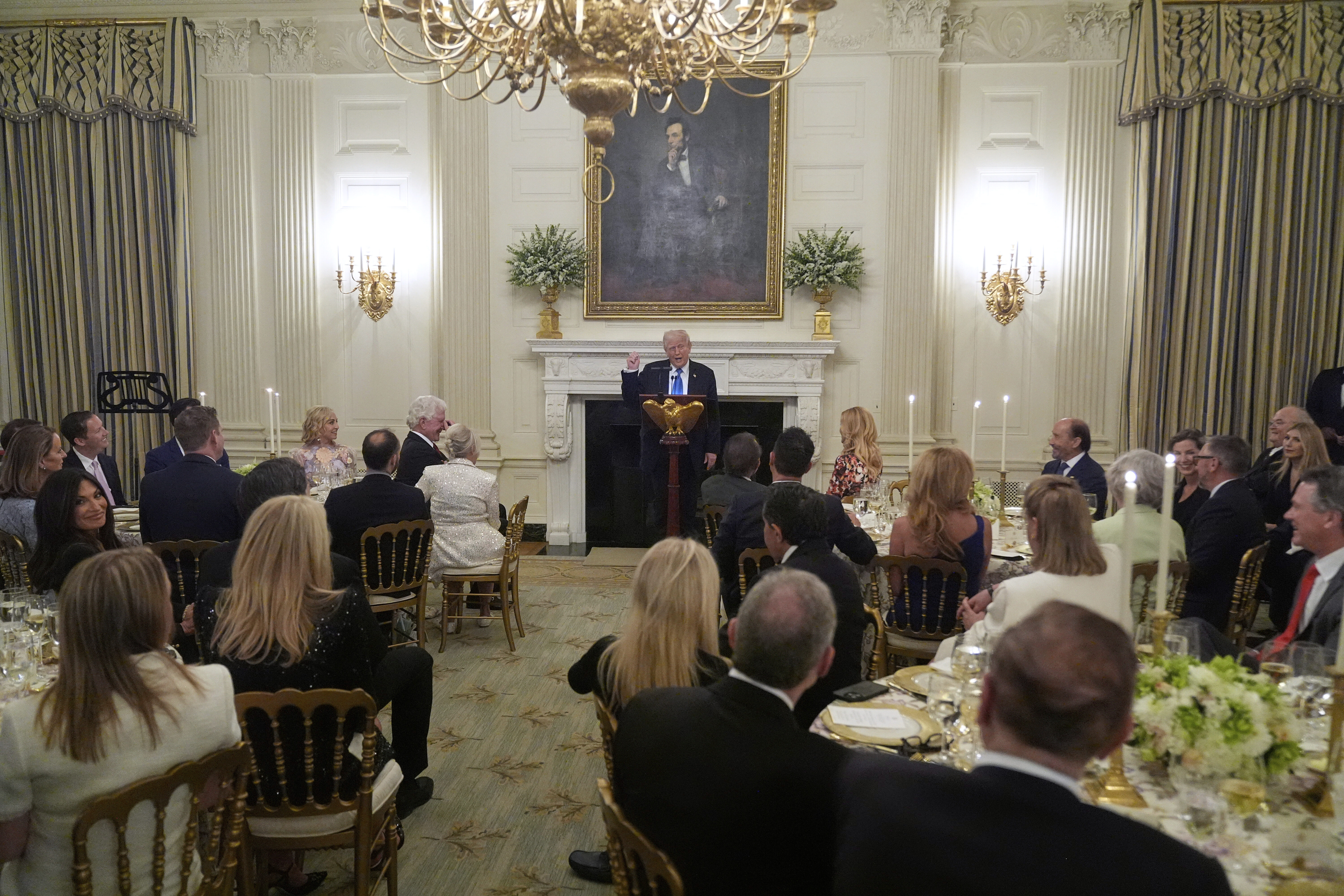 President Donald Trump speaks during a Kennedy Center board dinner in the State Dining Room at the White House, Monday, May 19, 2025, in Washington. (AP Photo/Manuel Balce Ceneta)