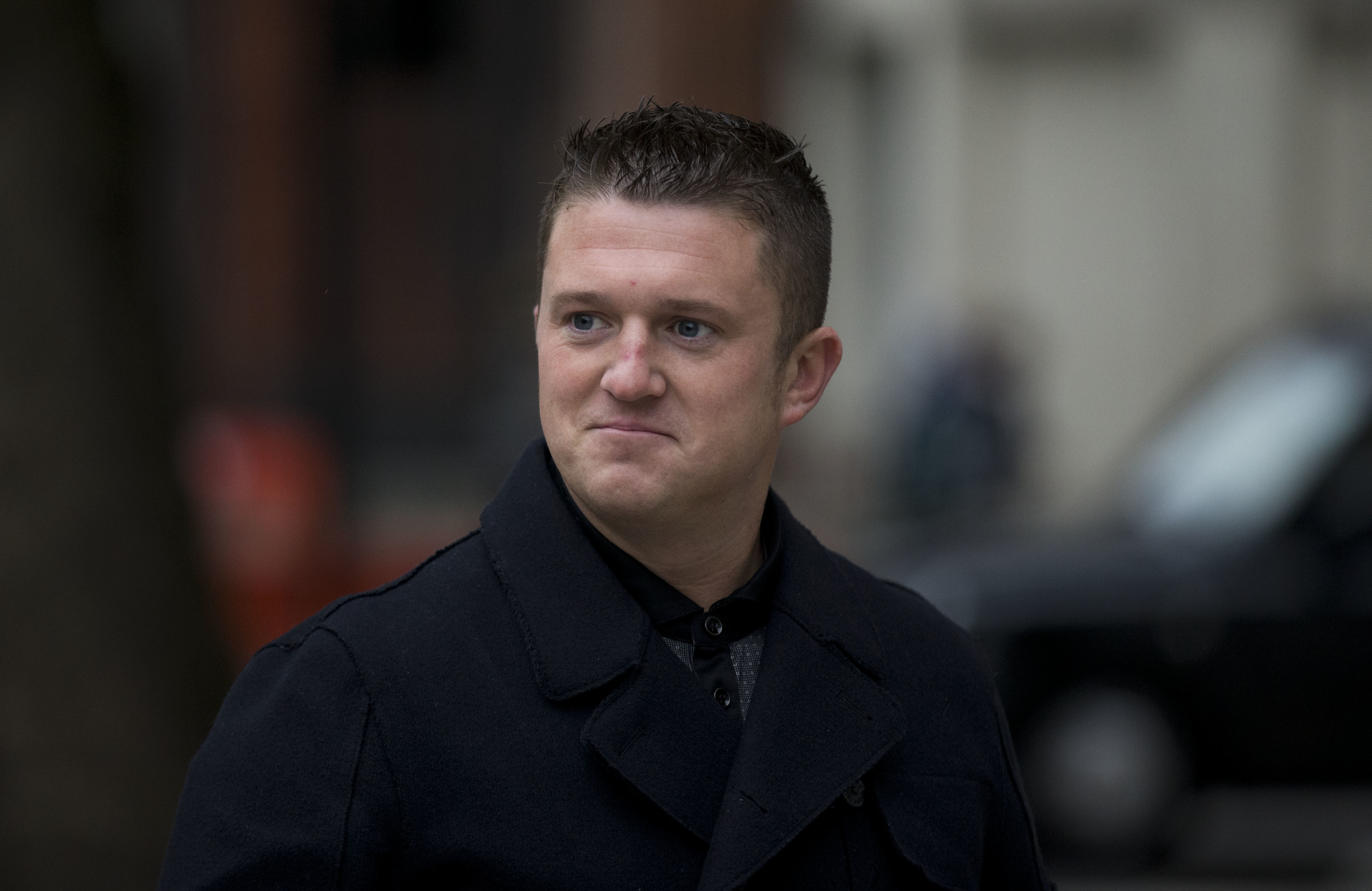 FILE - Tommy Robinson, the former leader of the far-right EDL "English Defence League" group arrives for an appearance at Westminster Magistrates Court in London, Oct. 16, 2013. (AP Photo/Matt Dunham, File)