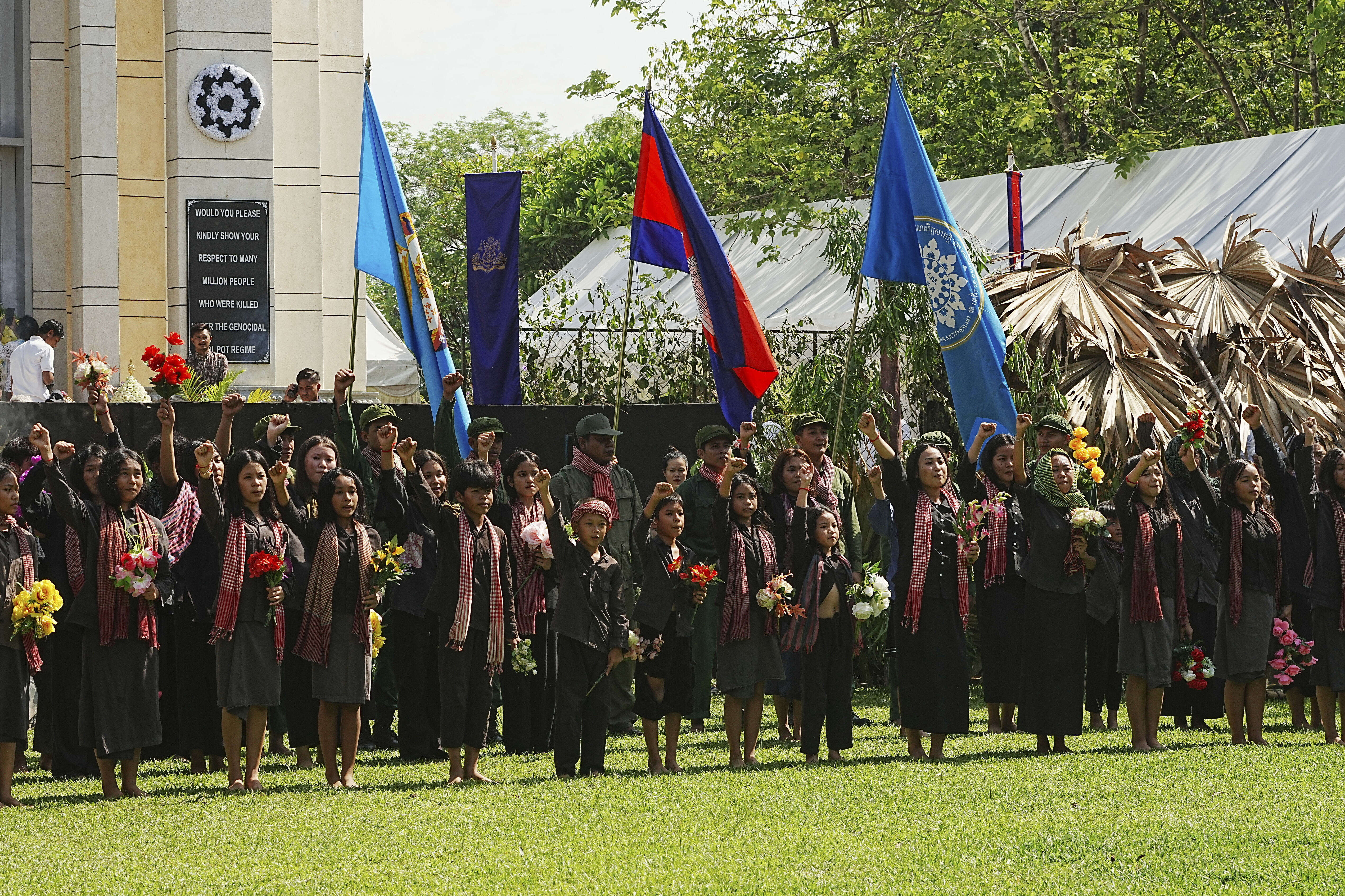 Cambodian students from Royal University of Fine Arts perform the Victory Day dancing during their reign of terror in the 1970s in an event hosted by the ruling Cambodian People's Party to mark the annual of Remembrance Day at Choeung Ek, a former Khmer Rouge "killing field," on the outskirt of Phnom Penh, Cambodia Tuesday, May 20, 2025. (AP Photo/Heng Sinith)