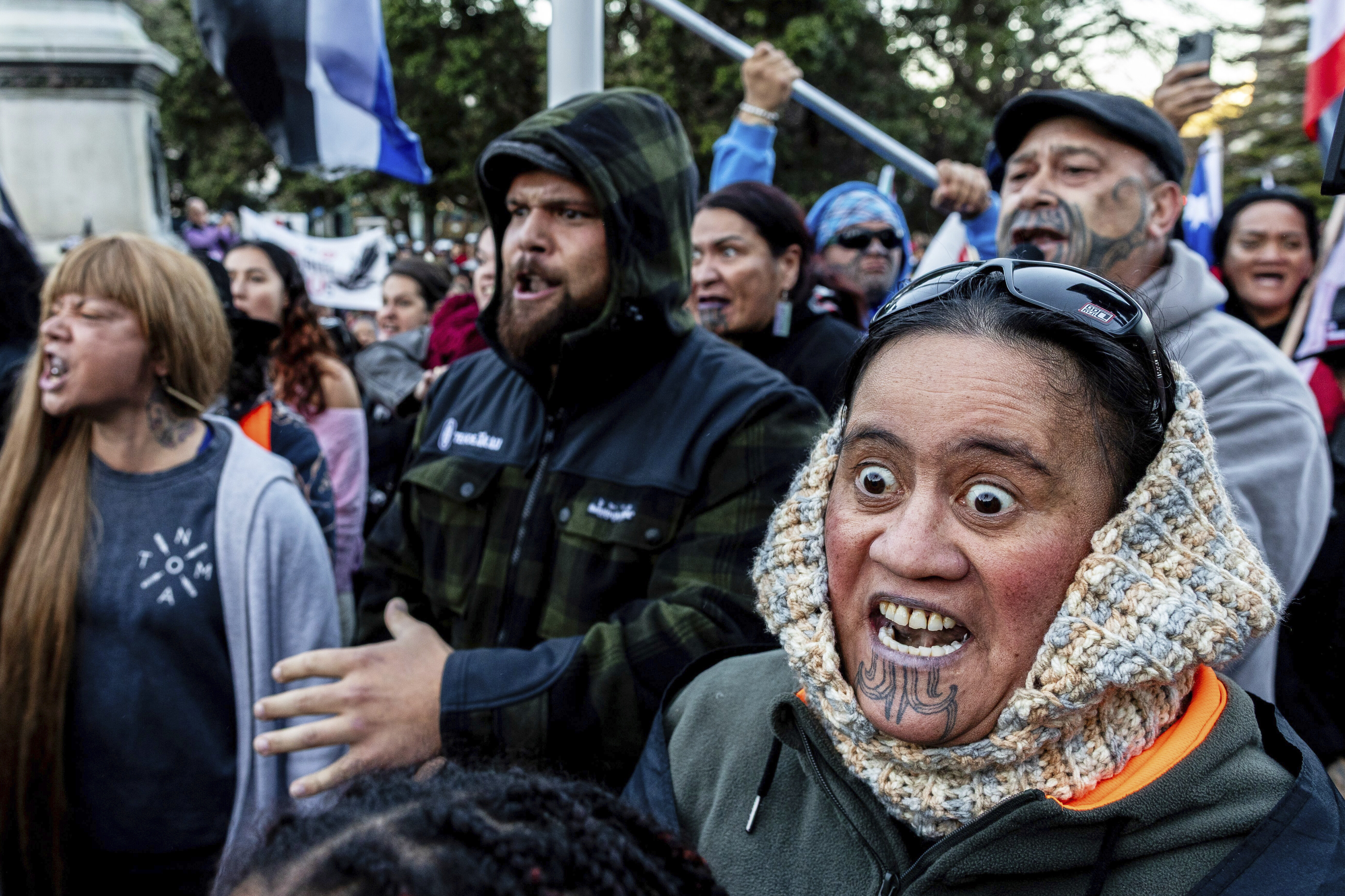 Protesters perform a haka outside parliament in Wellington, New Zealand, Tuesday, May 20, 2025. (David Unwin/Stuff via AP)