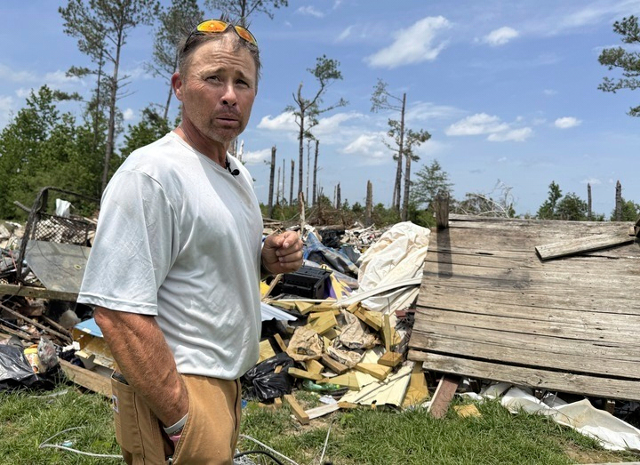 Brian Lowery stands before what remains of his home, which was ripped apart by a tornado, in Tylertown, Miss., on Thursday, May 15, 2025. (AP Photo/Sophie Bates)